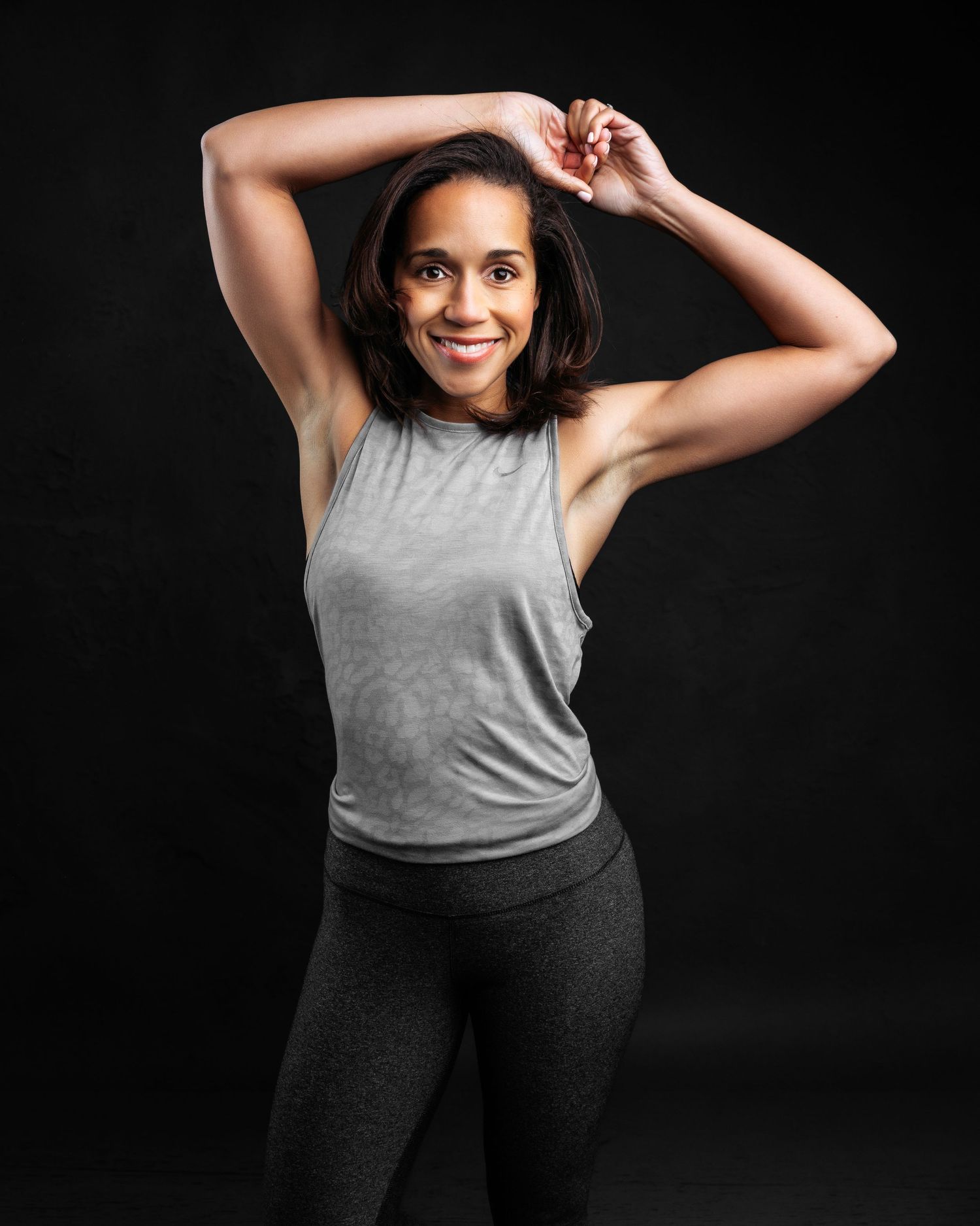 Dynamic poses in grey athletic wear against black background.