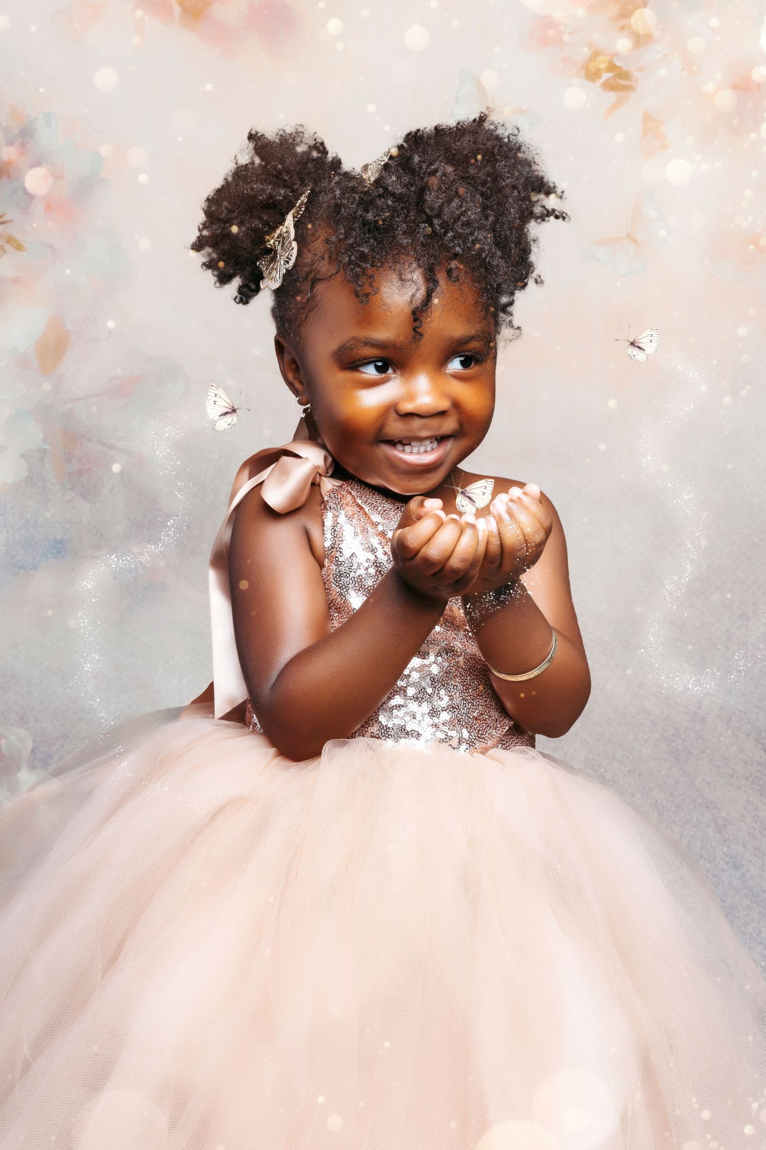 Magical princess photo session featuring sparkly dress and dreamy pink backdrop.