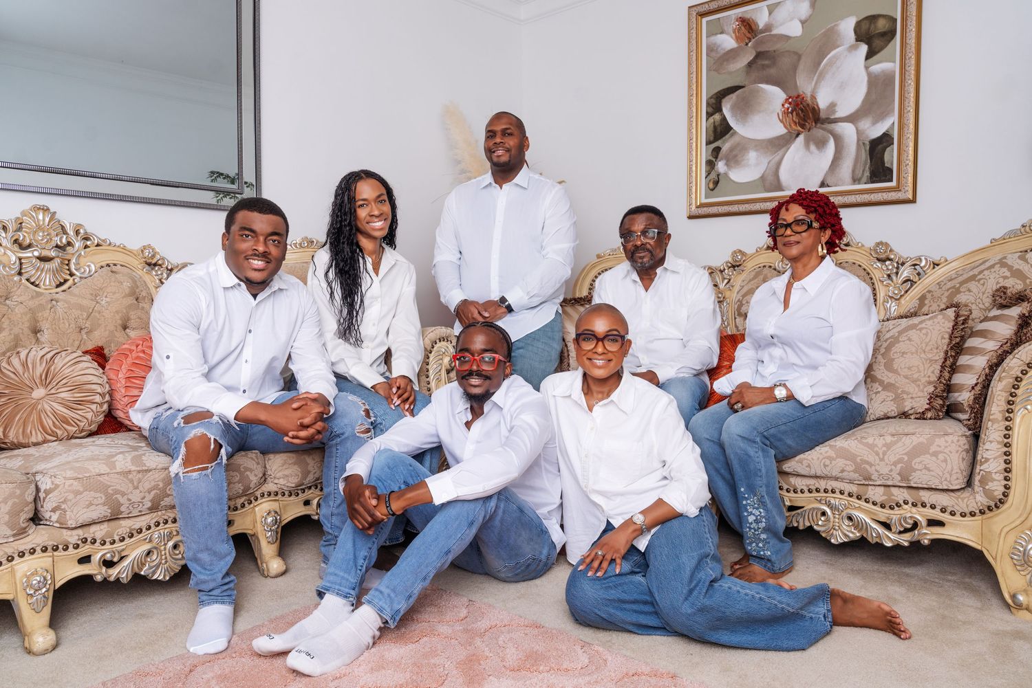 Family portrait session with casual outfits against white background showing multiple poses and arrangements.