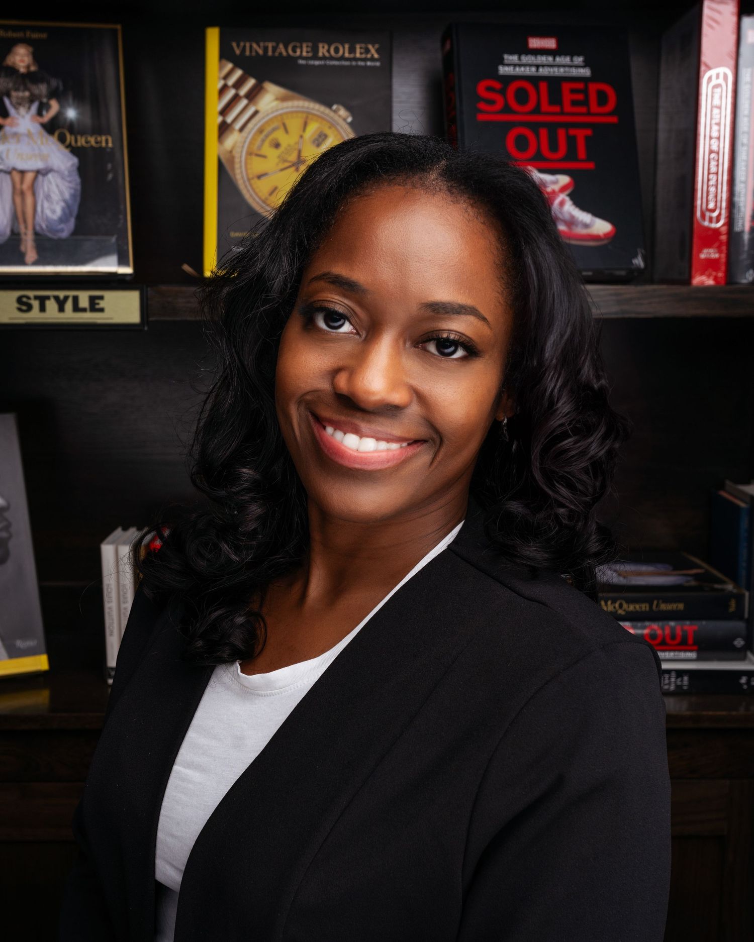 Professional photos against dark background with vintage posters and decor.