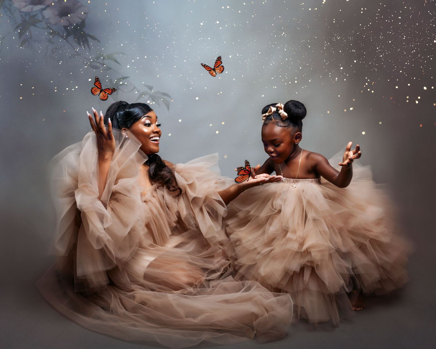 Dreamy portraits with butterflies featuring flowing blush tulle dress against a misty gray backdrop.