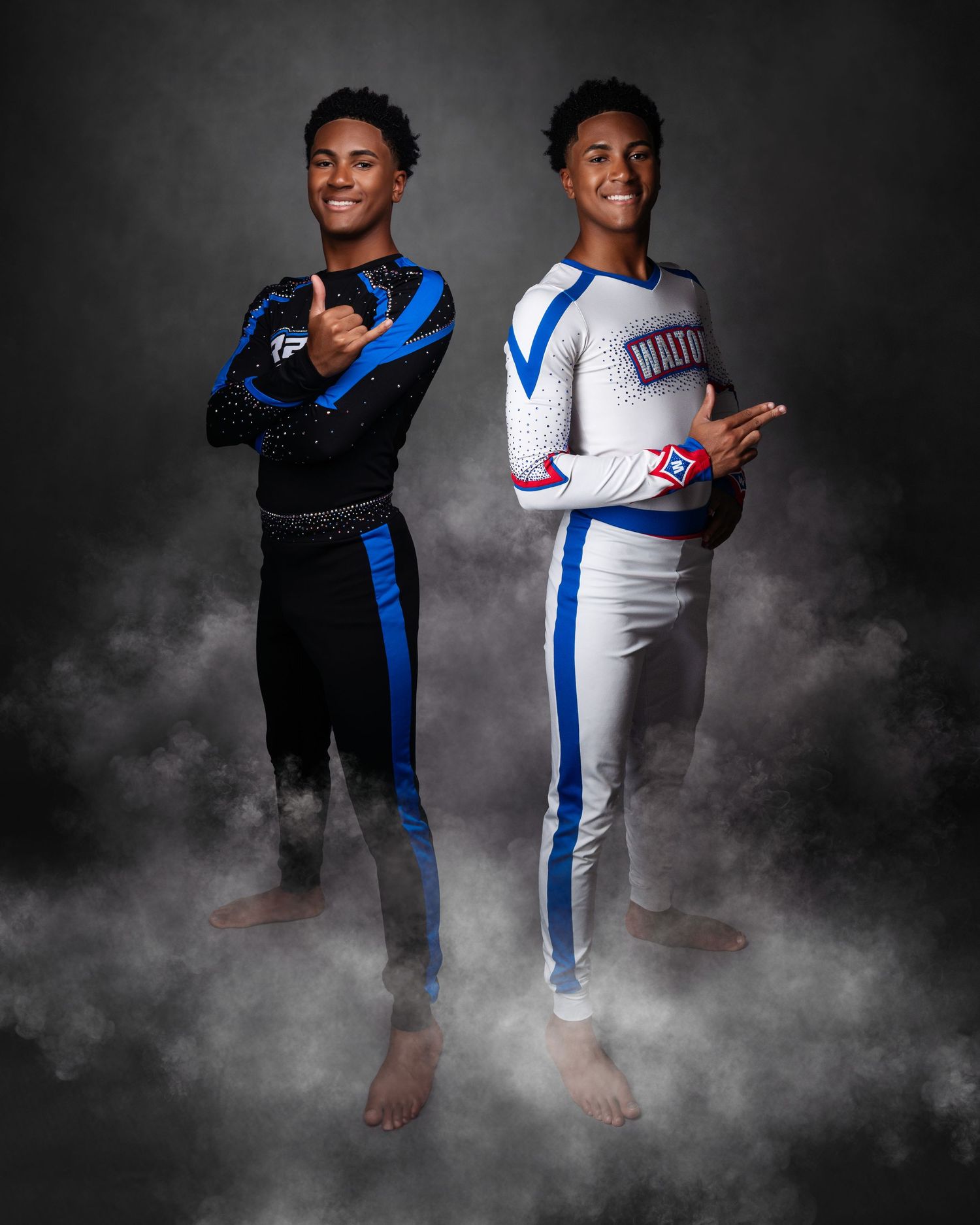 Athletic poses in sportswear against dramatic smoky studio backdrop.