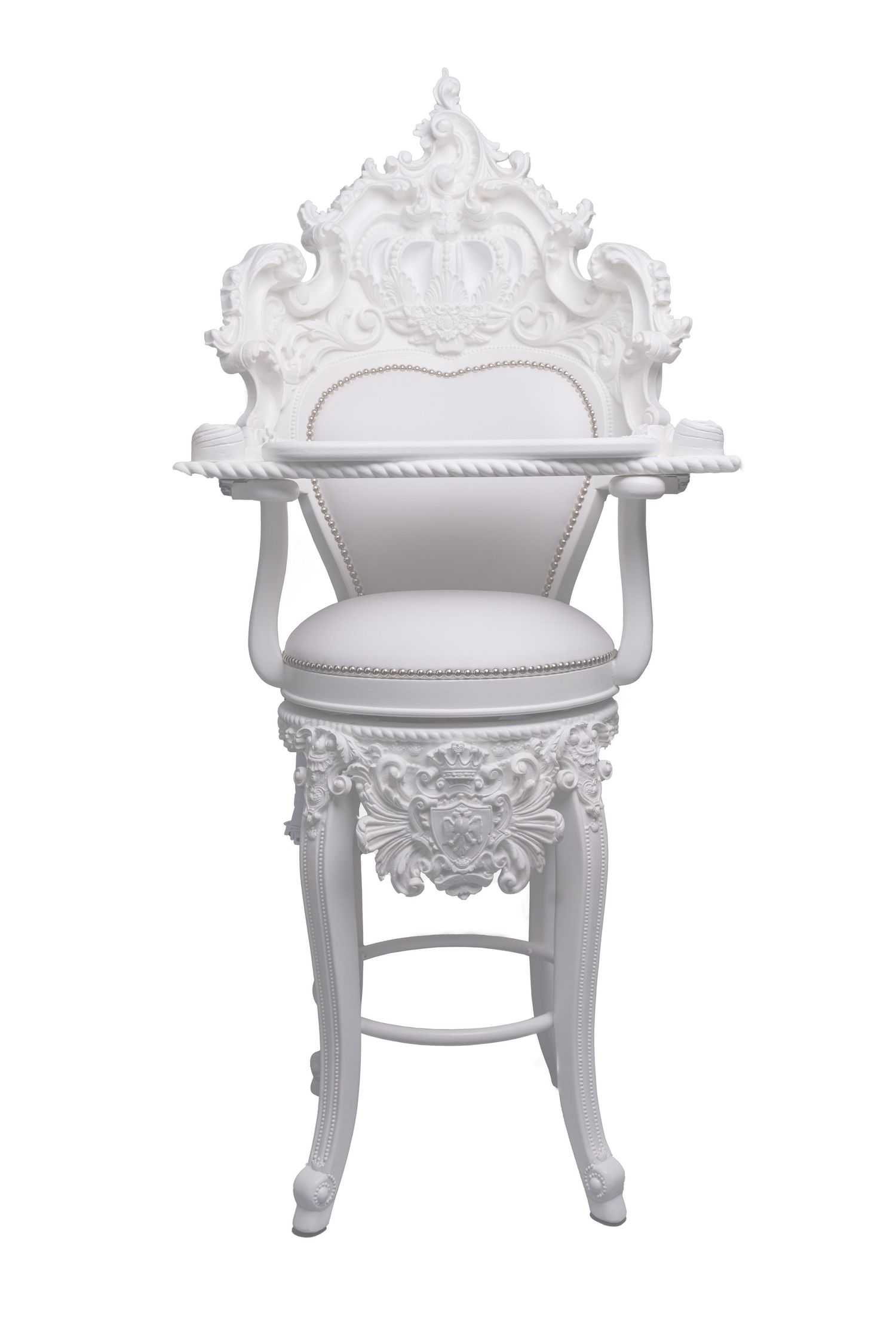 A decorative white baroque-style chair with ornate carved details and upholstered seat.