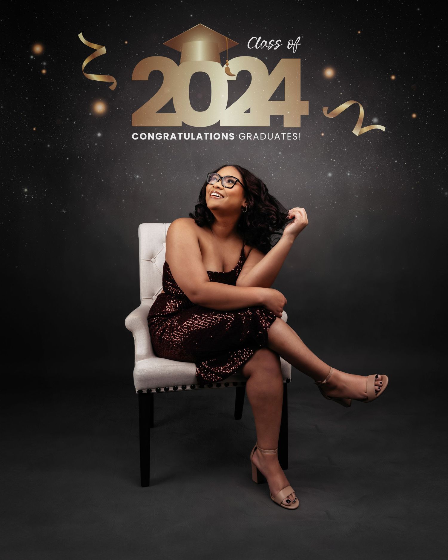 Glamorous graduation photo shoot with gold 2024 decorations and sparkly dark backdrop.