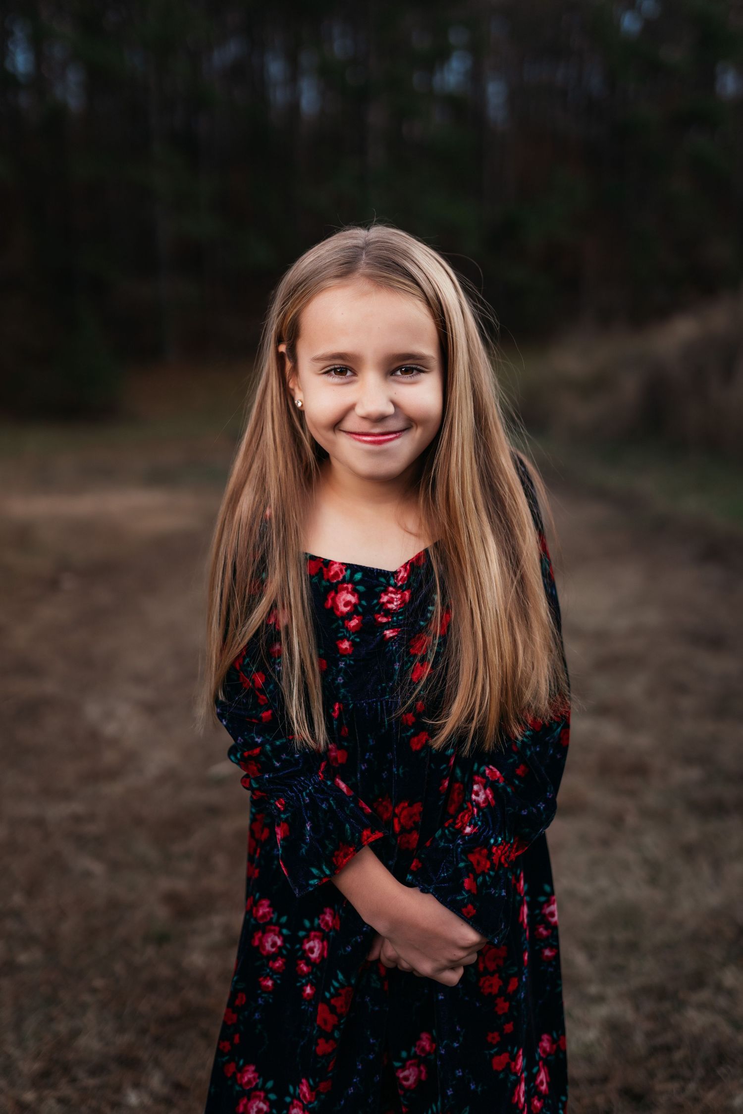 Series of portrait shots showing young person in floral dress against natural backdrop.