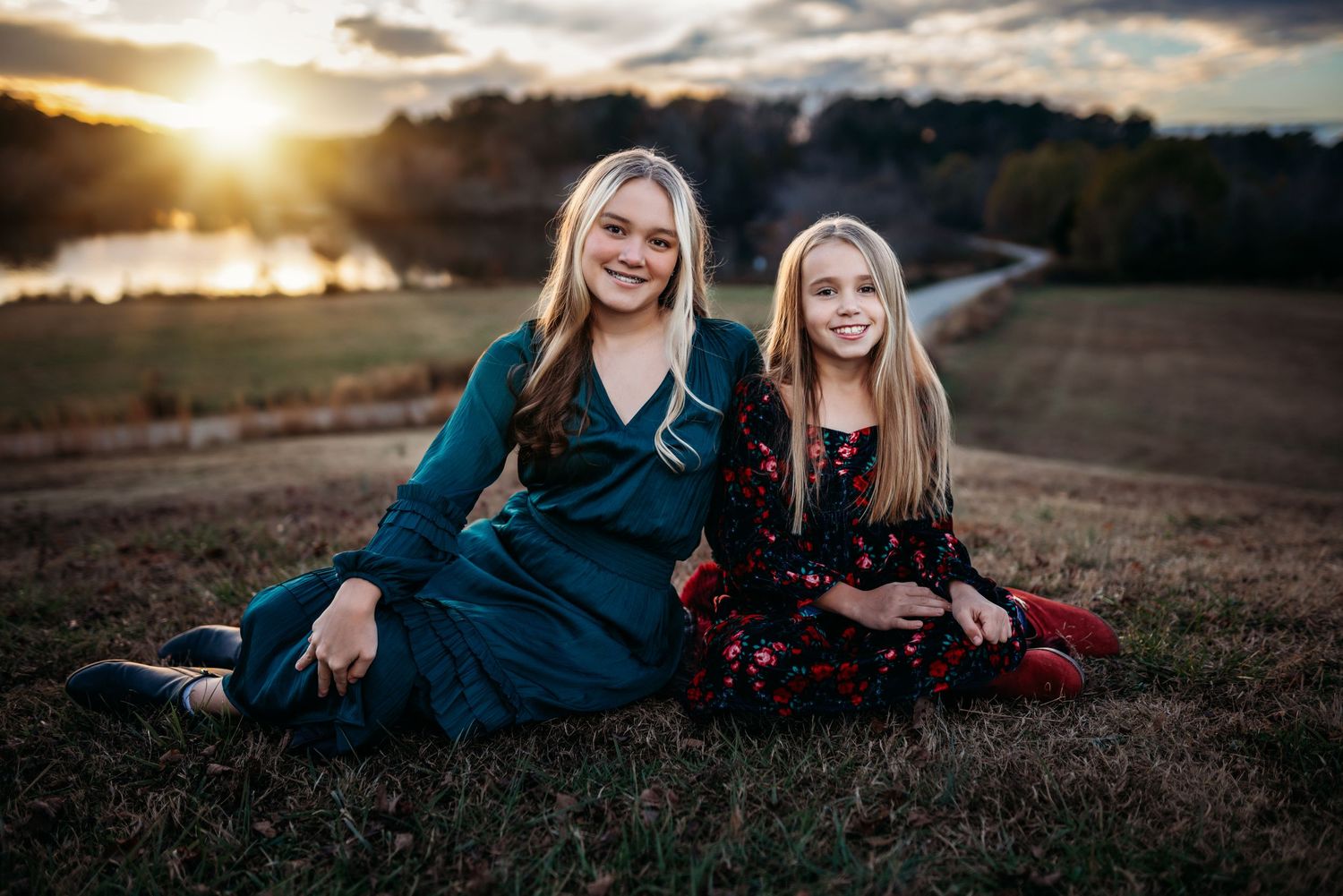 Candid outdoor portraits at sunset with people in coordinated blue and red outfits.
