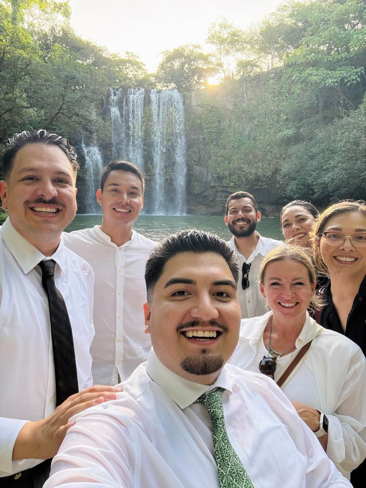 Wedding photography team posing with couple after elopement at Rio Perdido, Costa Rica