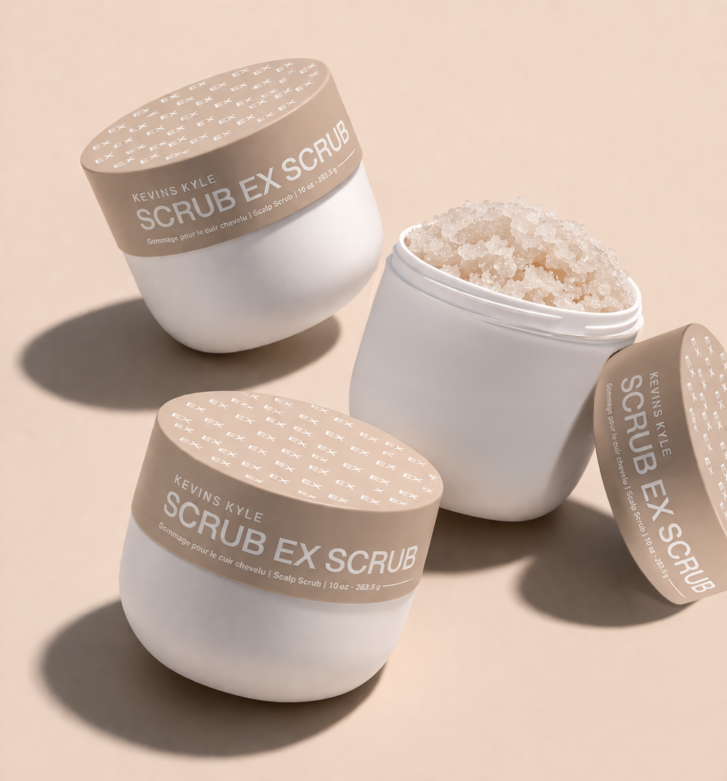 Three white jars of Scrub Ex Scrub exfoliating body scrub on a beige background.