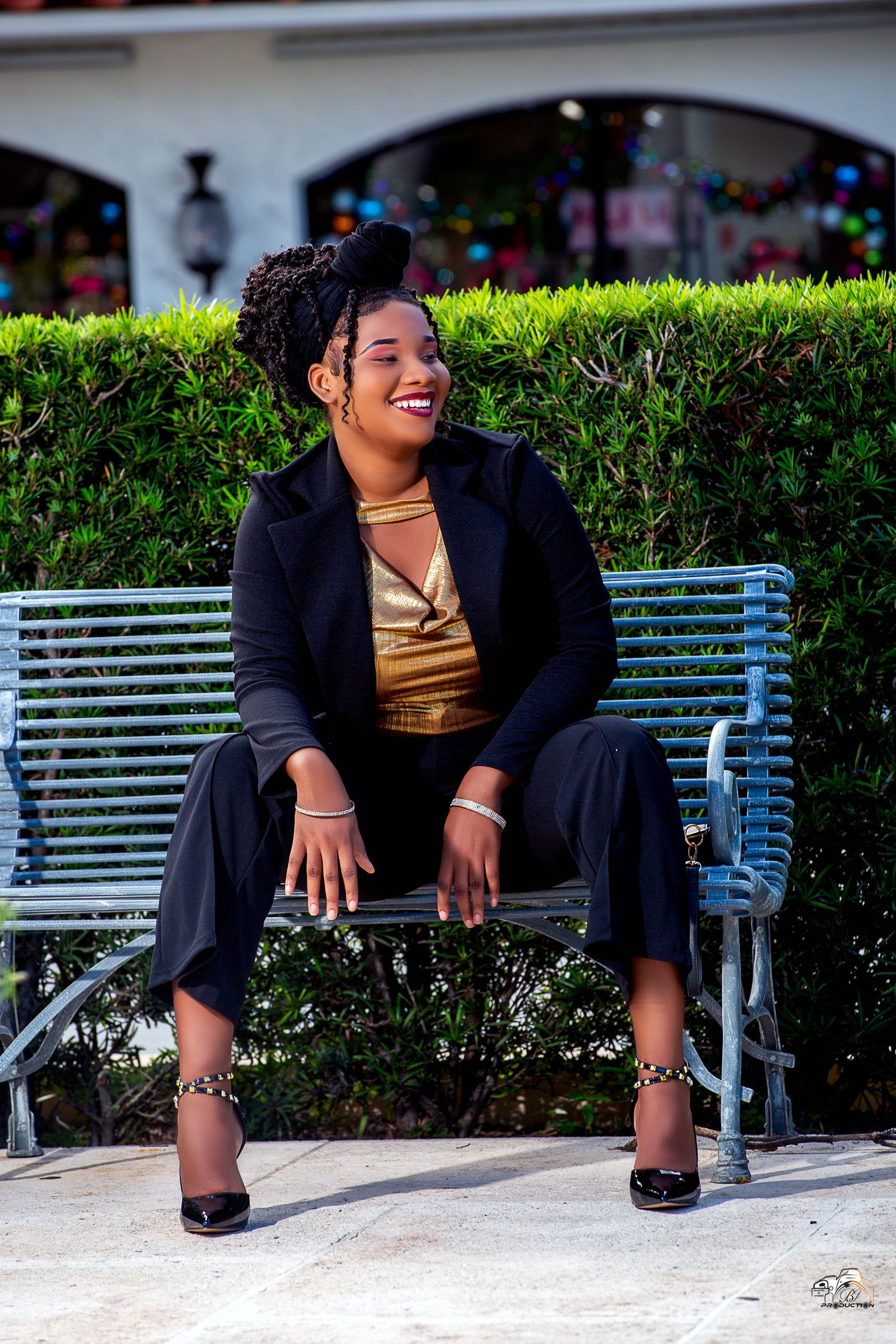 A series of photos showing someone sitting on a green park bench wearing a black blazer and gold top against hedges.