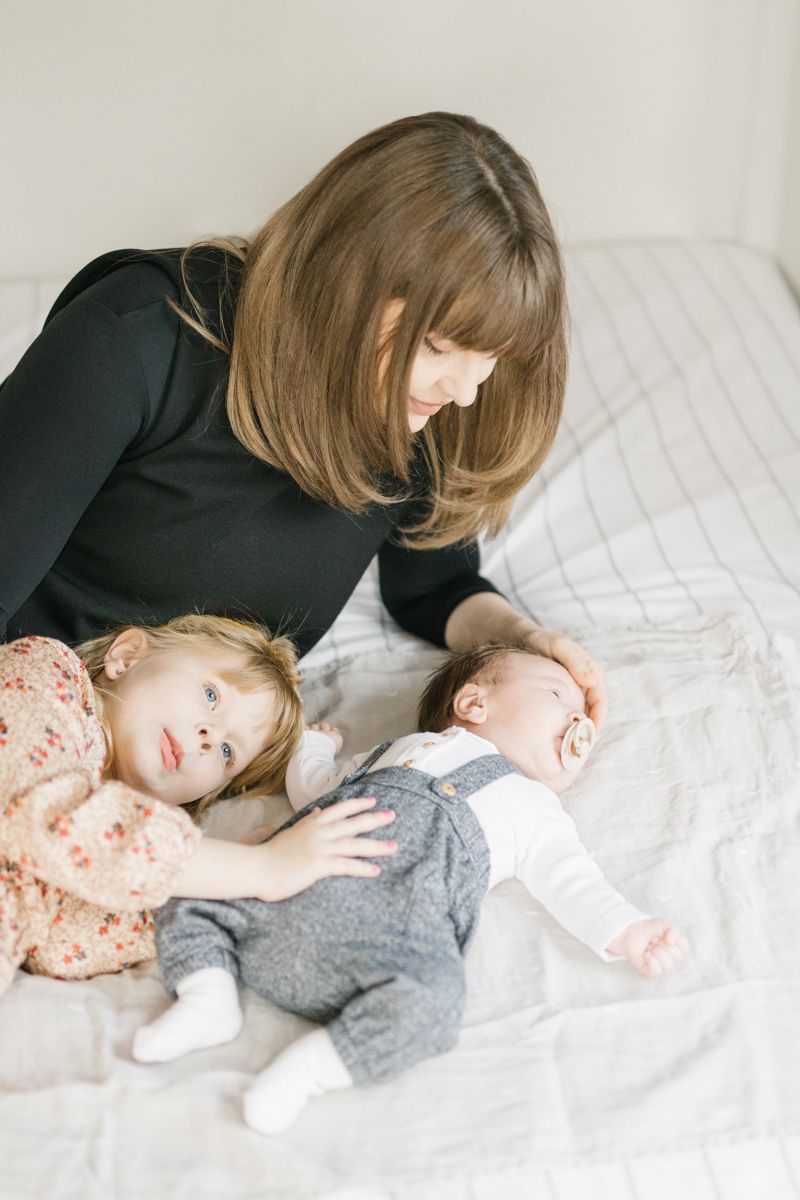 Peaceful bedtime scene with gentle moments of rest on white bedding.
