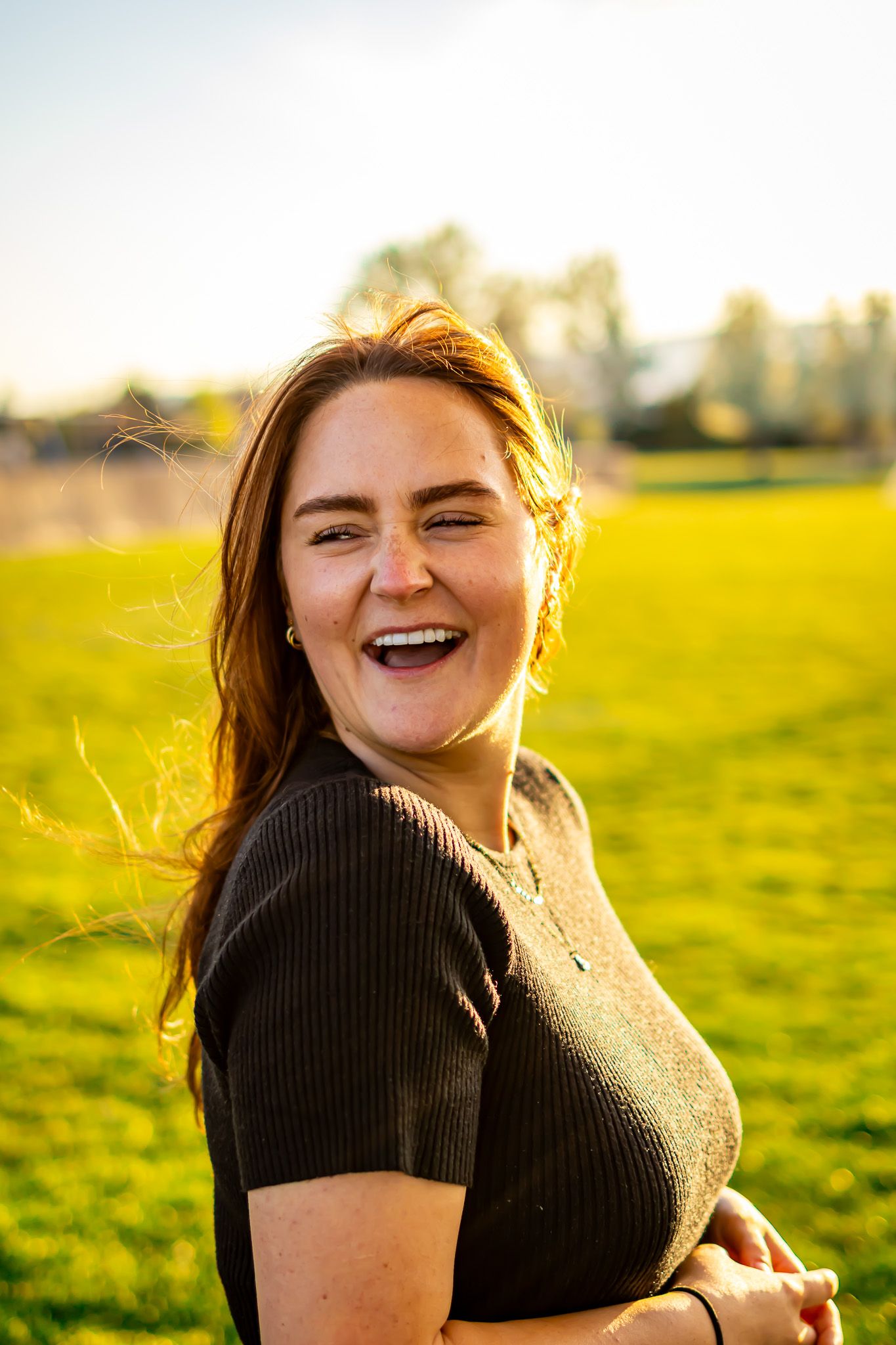 Cute portrait of woman at park in Utah with green background
