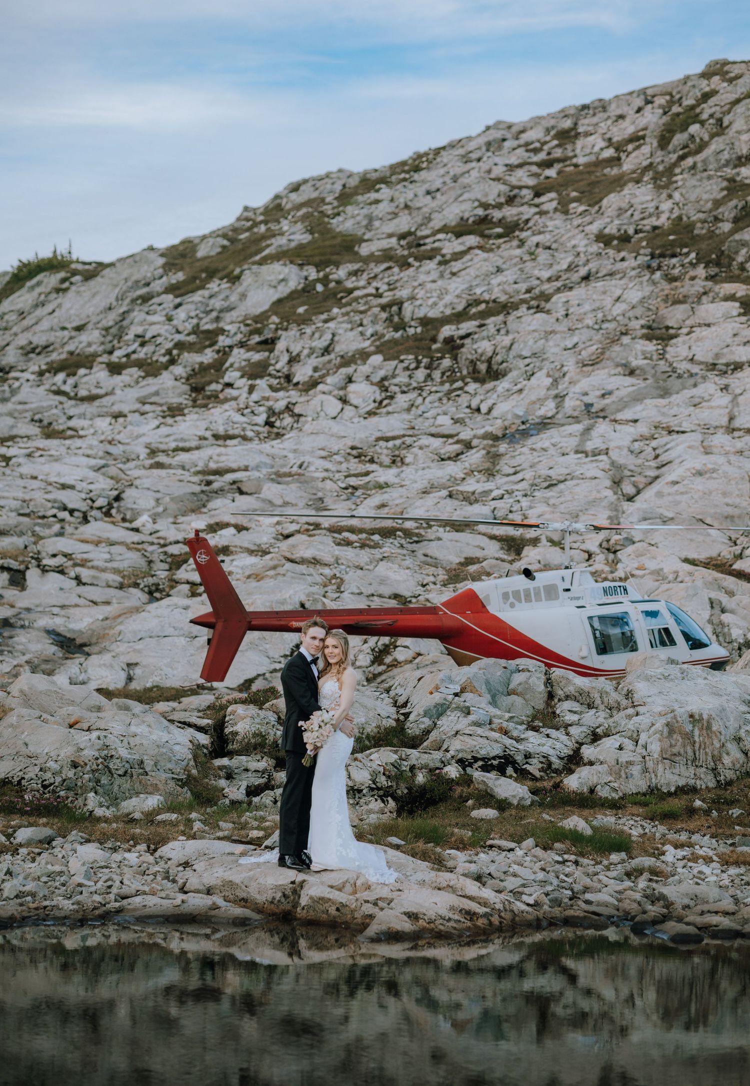 helicopter elopement on Vancouver Island outside of Campbell River next to a mountain with mountains in the background
