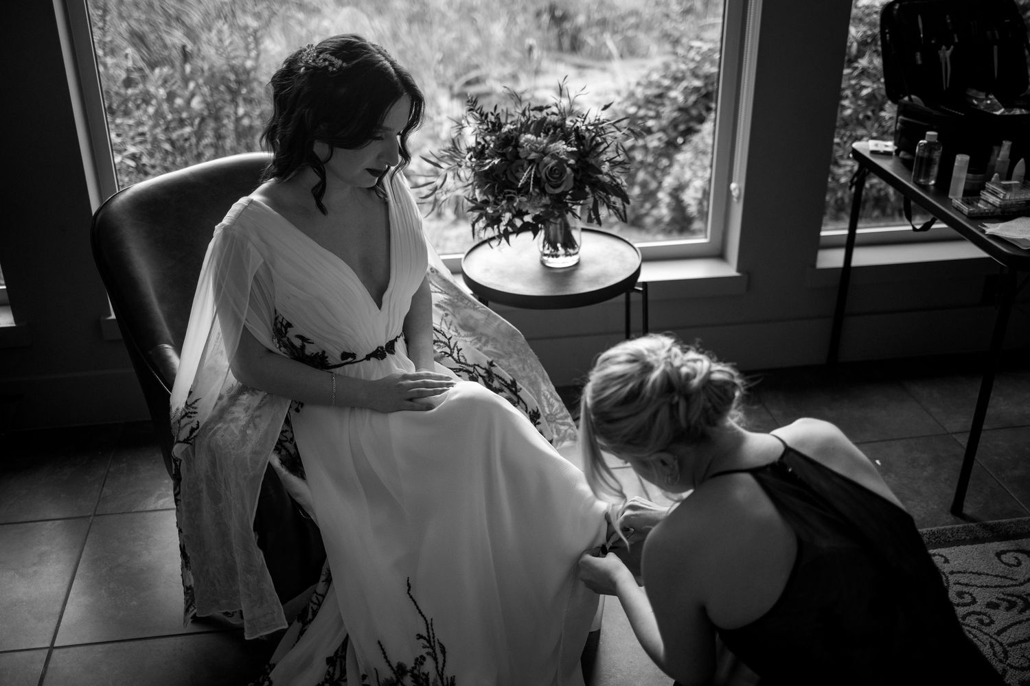 A black and white photo series showing intimate moments between a couple on their wedding day.