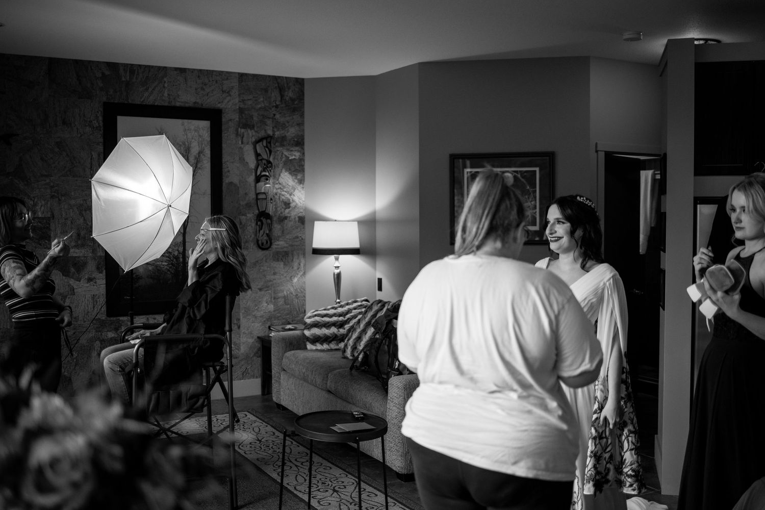 A black and white photo montage showing behind-the-scenes wedding day getting ready with lighting equipment and cameras.