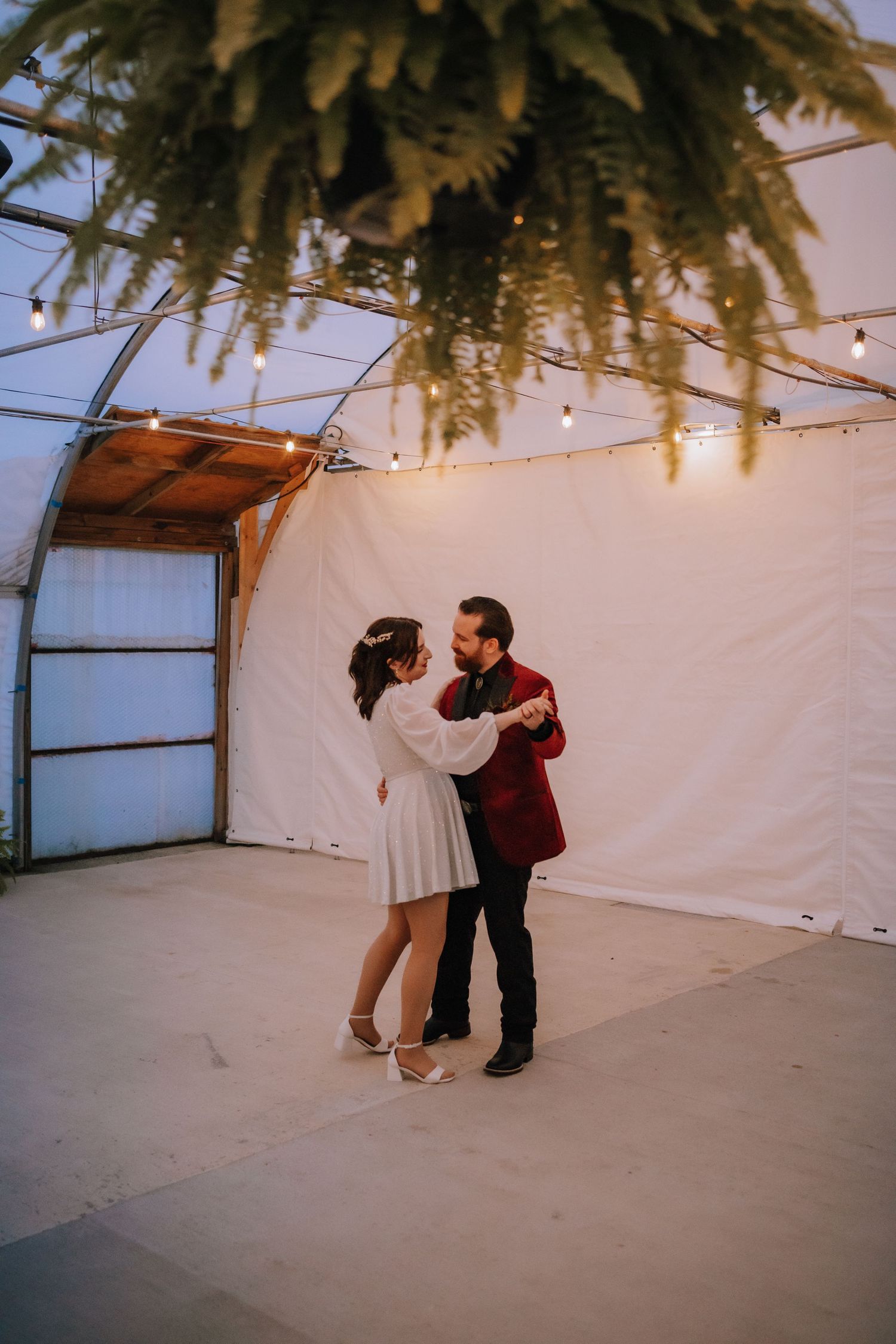 first dance at a fall wedding in a greenhouse