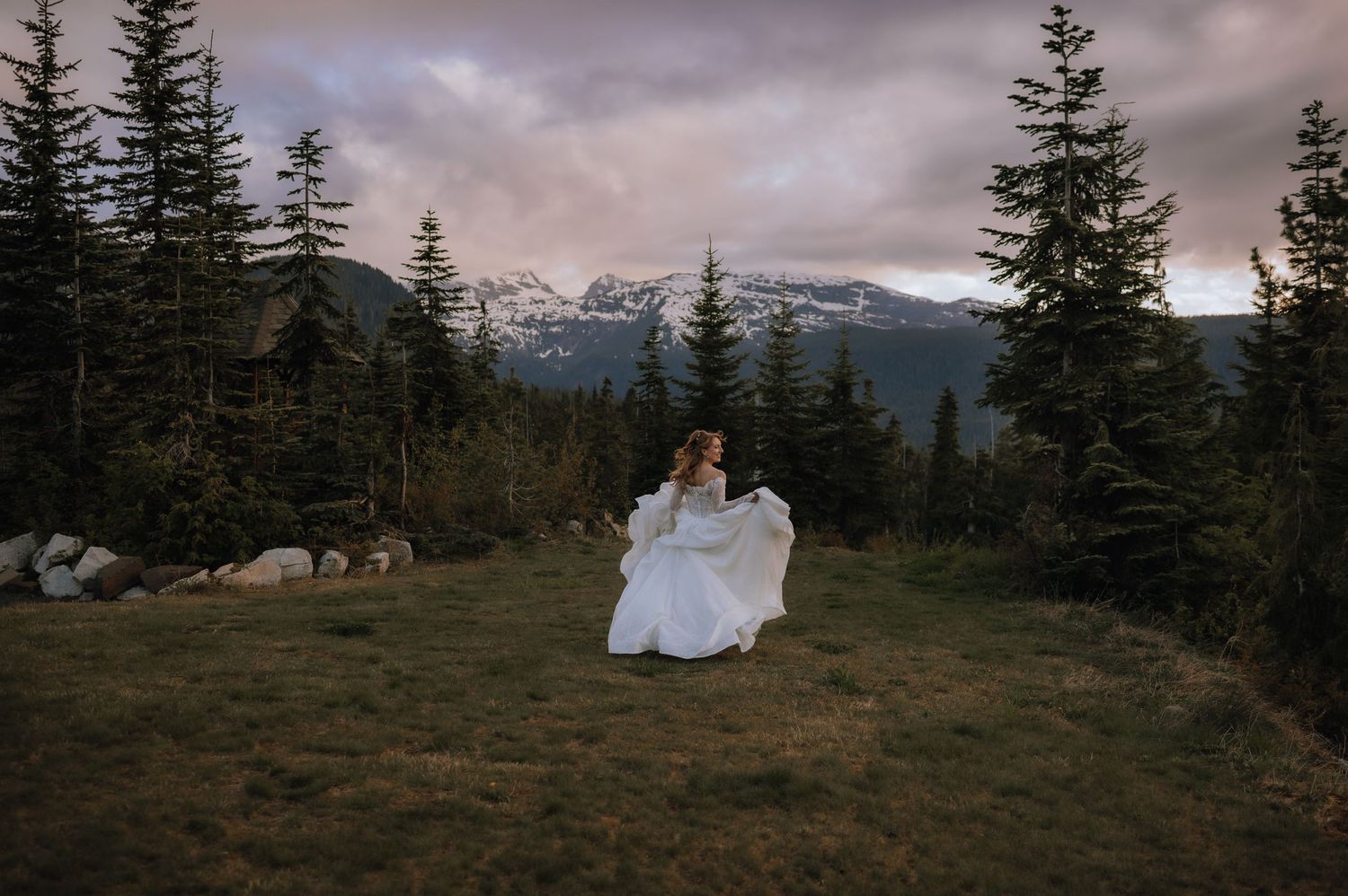 bride running at sunset during portraits at Mount Washington alpine resort wedding on vancouver island