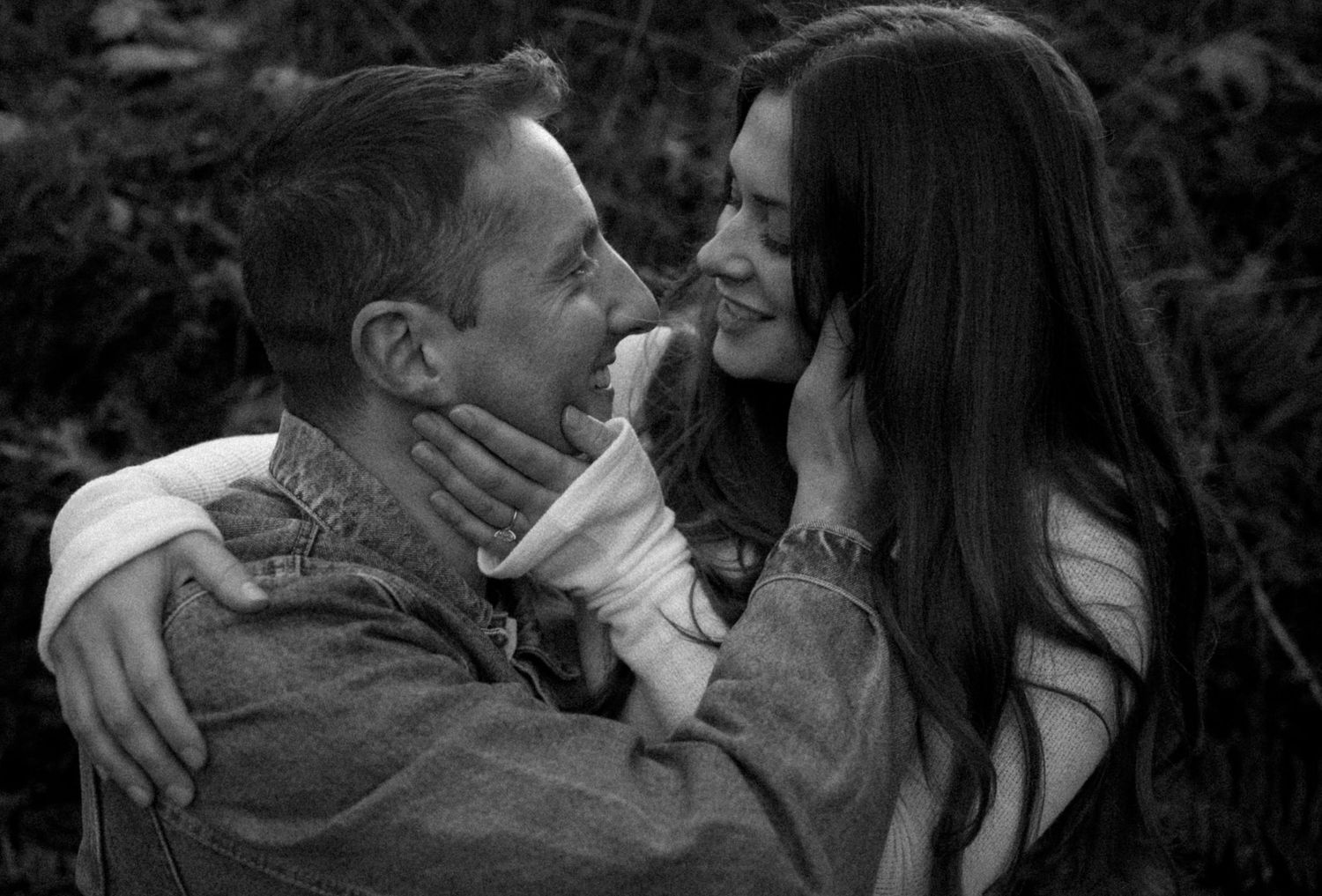 A series of black and white romantic photographs showing intimate moments between two people.