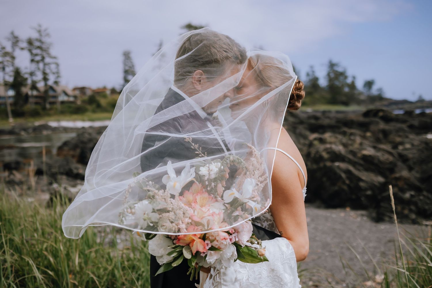 bride and groom on the beach in ucluelet at black rock resort and spa