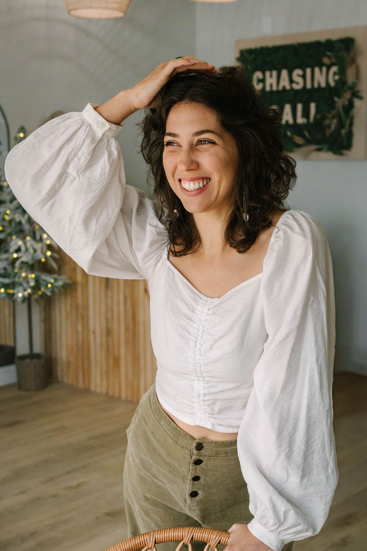 Casual lifestyle photography in rustic room with wooden accents and pendant lighting.