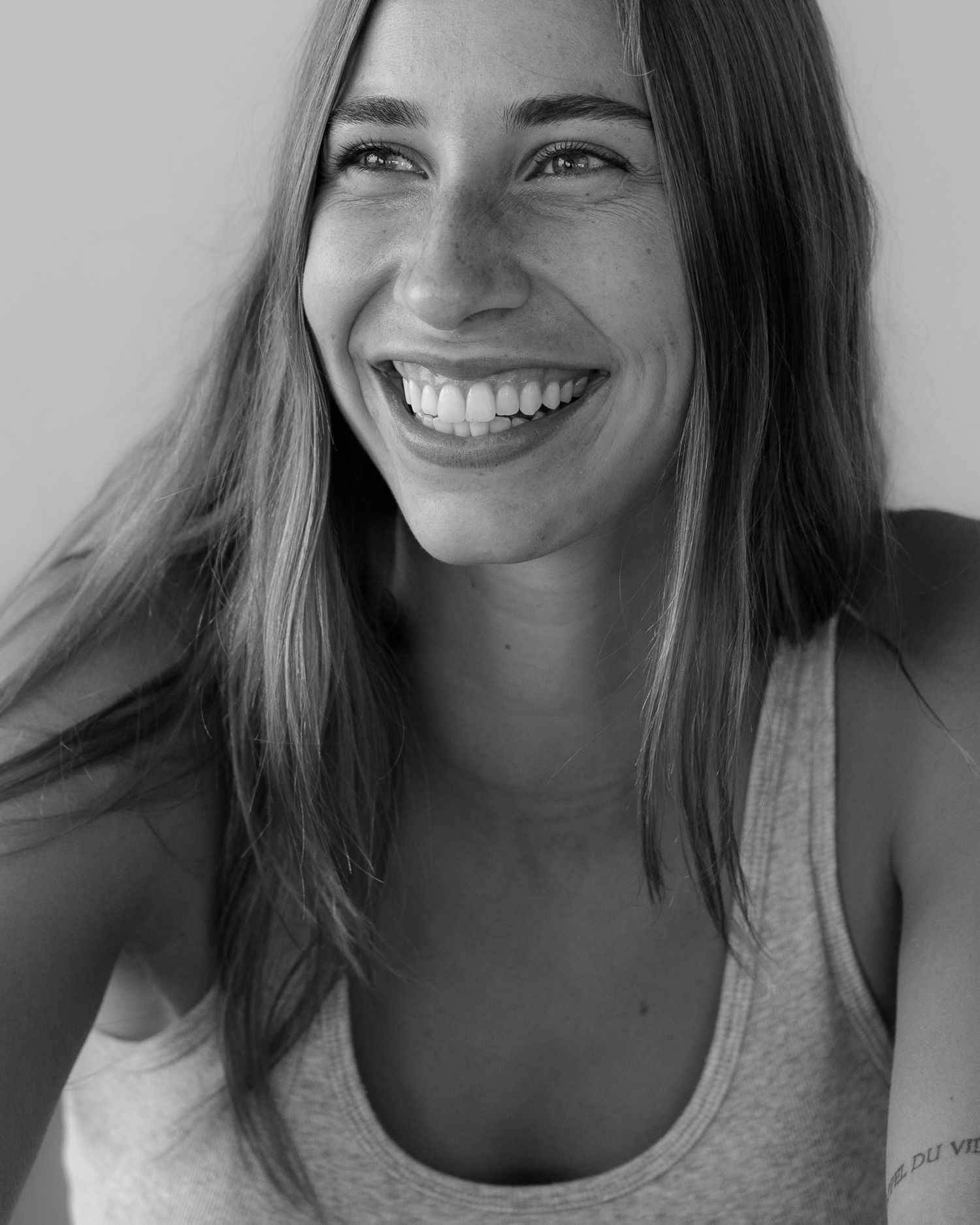 Progressive series of expressions from subtle to bright smile in black and white.