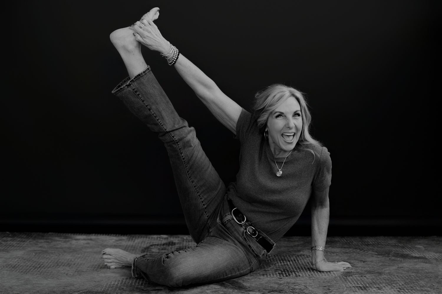 Black and white portrait series showing natural expressive movement against dark background.