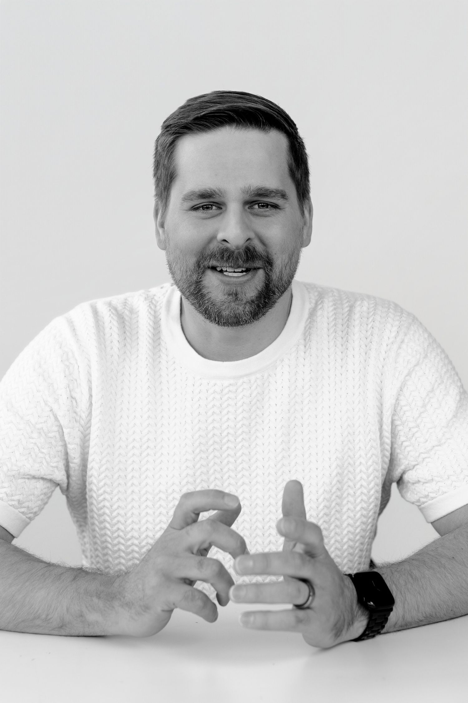 Person in white t-shirt showing sequence of animated expressions on light background.