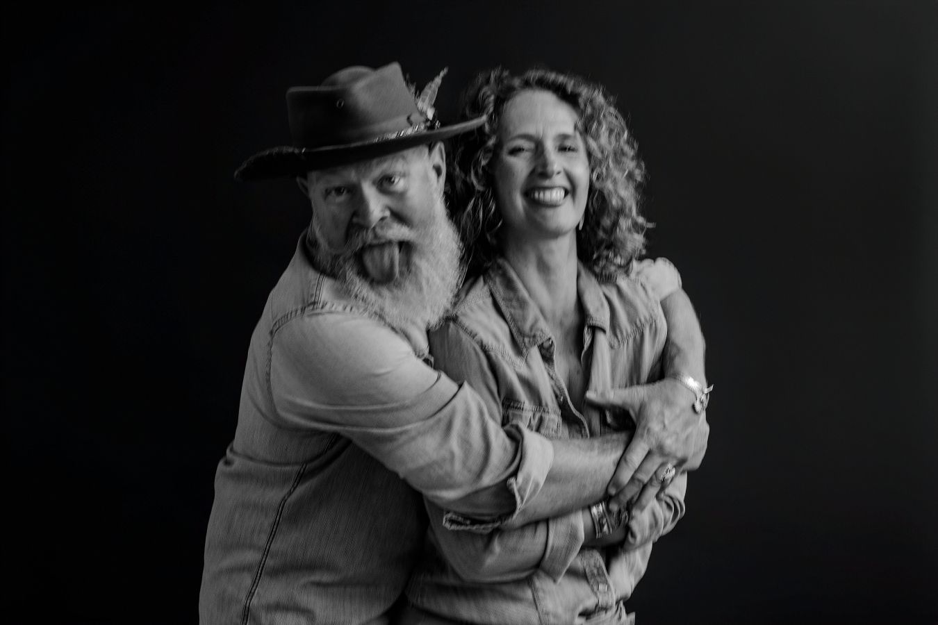 Natural black and white photo of couple displaying genuine affection.