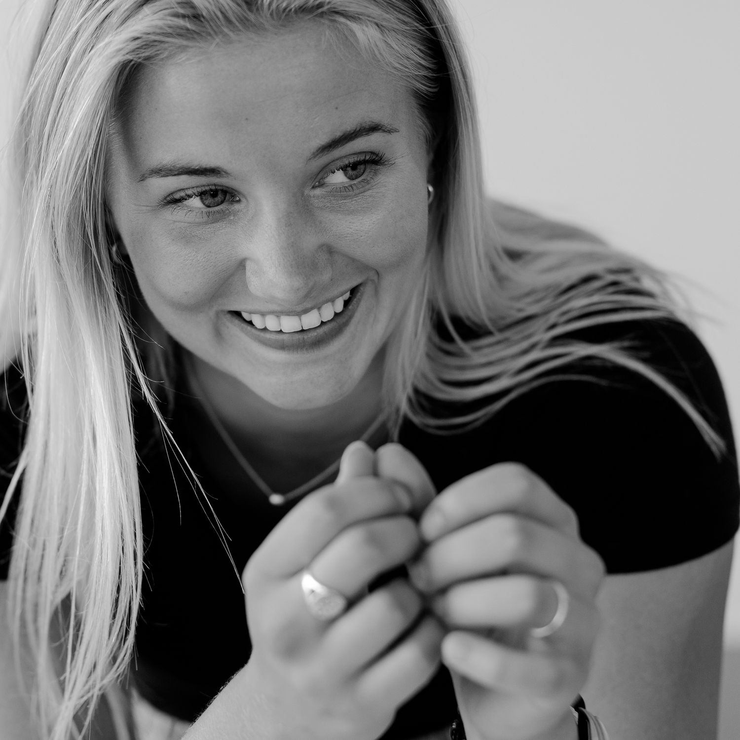 Series of expressive black and white portraits showing joyful moments.