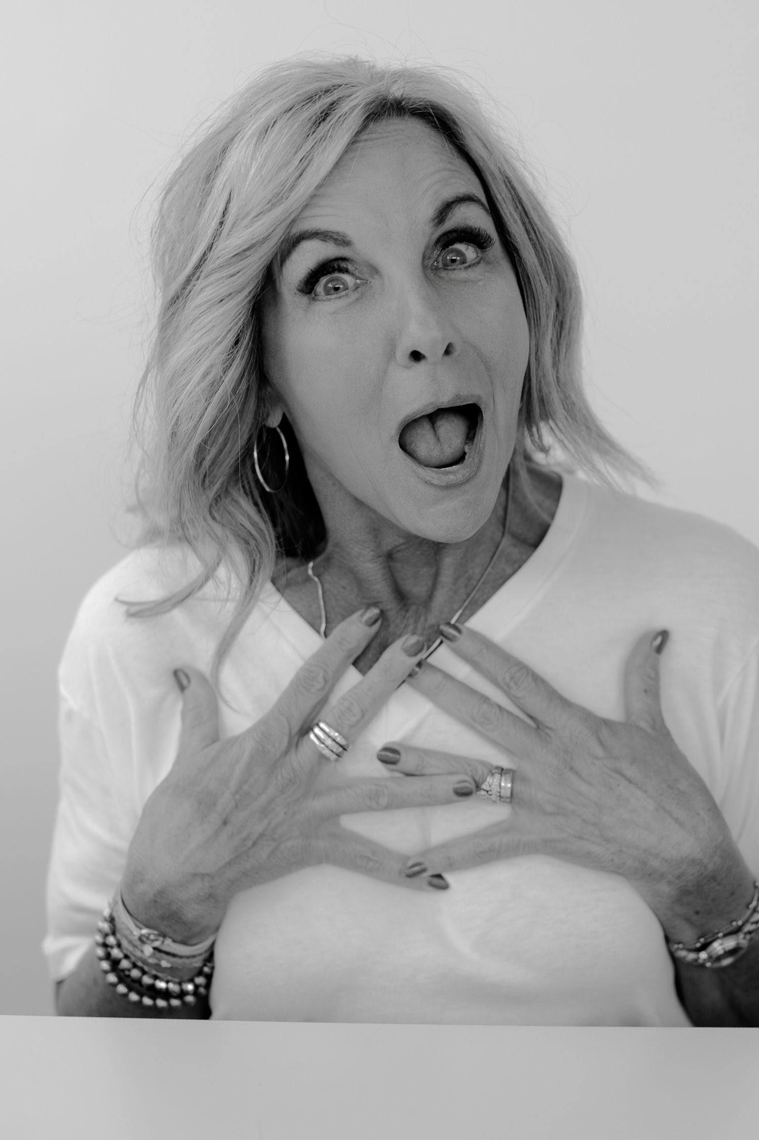 Dramatic black and white photo series with exaggerated expressions and hand gestures.