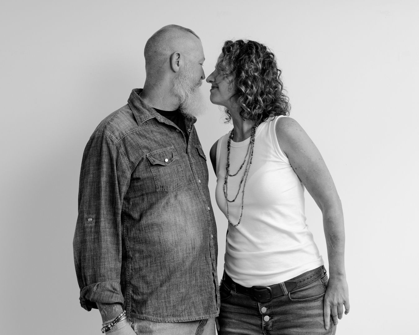 Black and white portrait series capturing natural moments between a couple.