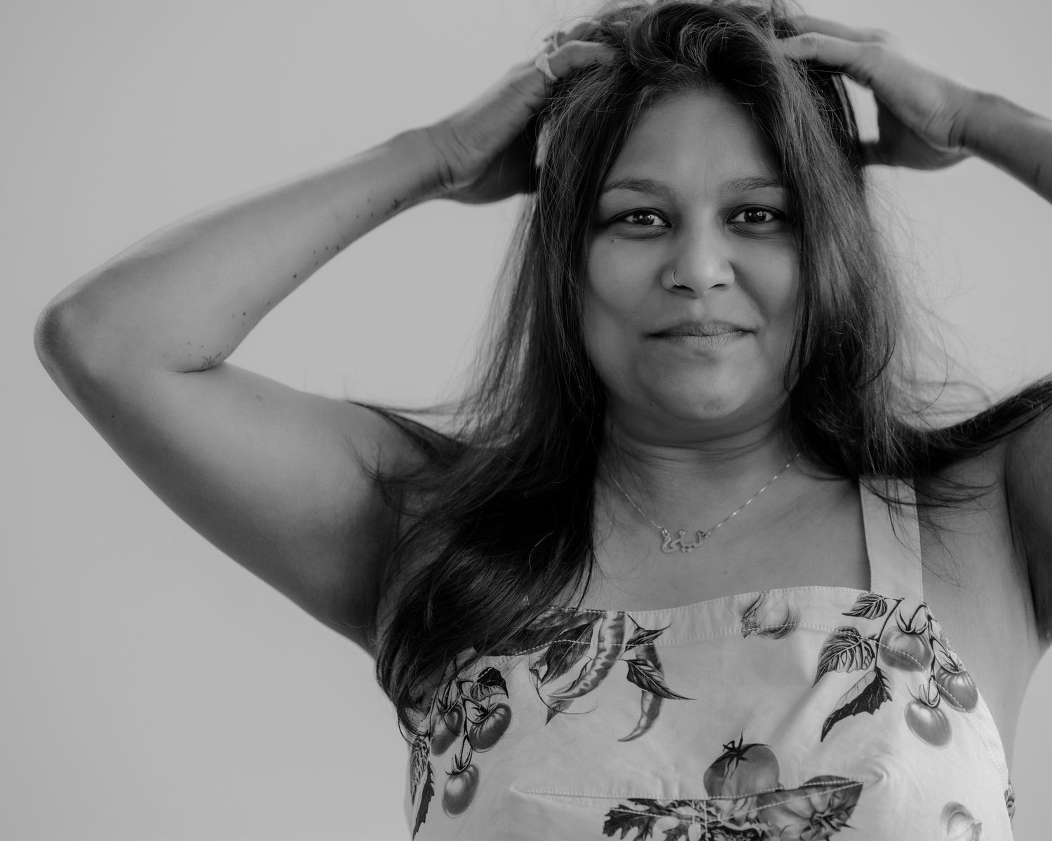 Portrait series showing expressive hand gestures and body language in black and white.