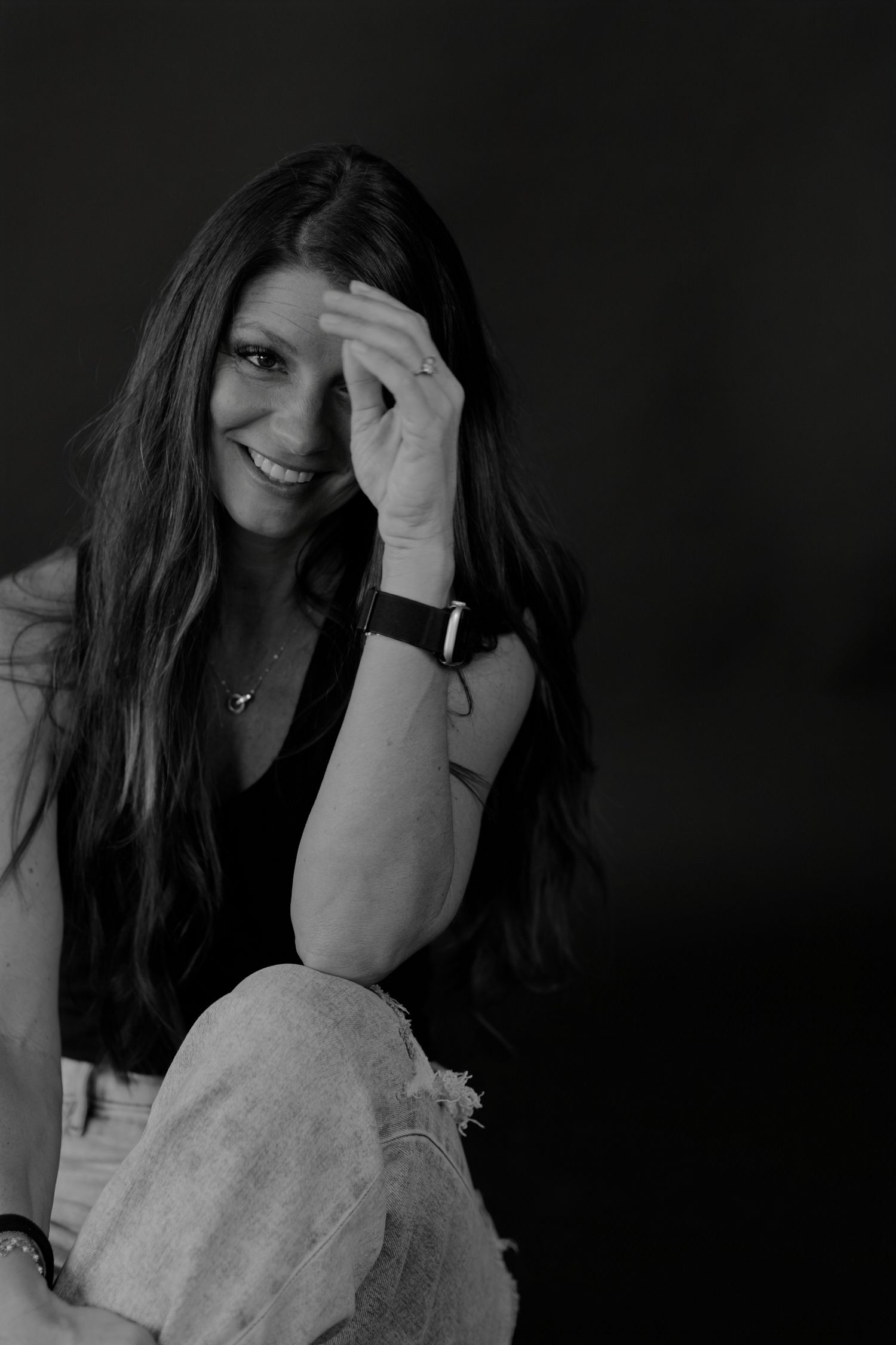 Monochrome portrait series showing relaxed poses and natural expressions.