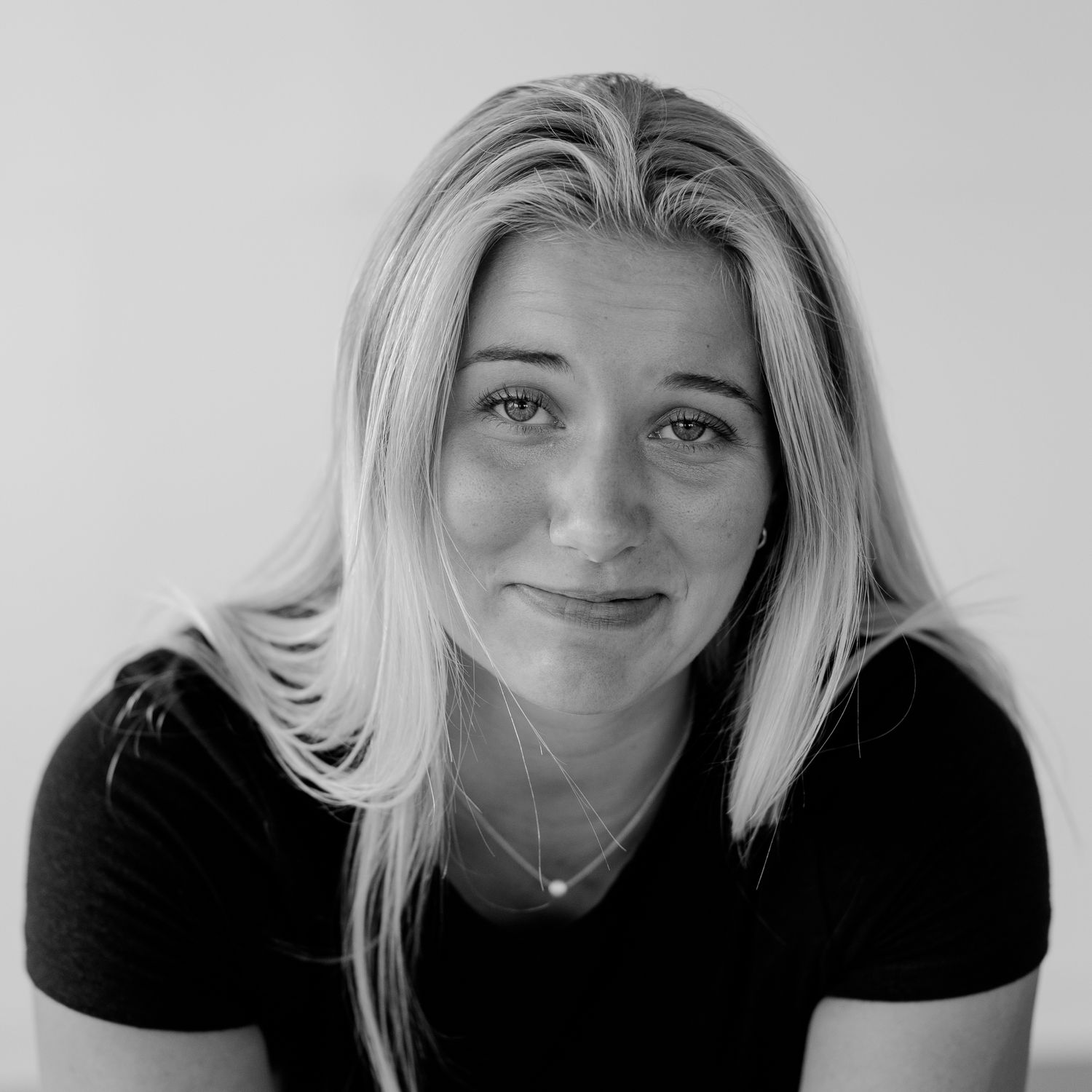 Series of black and white headshots showing various expressions and poses.
