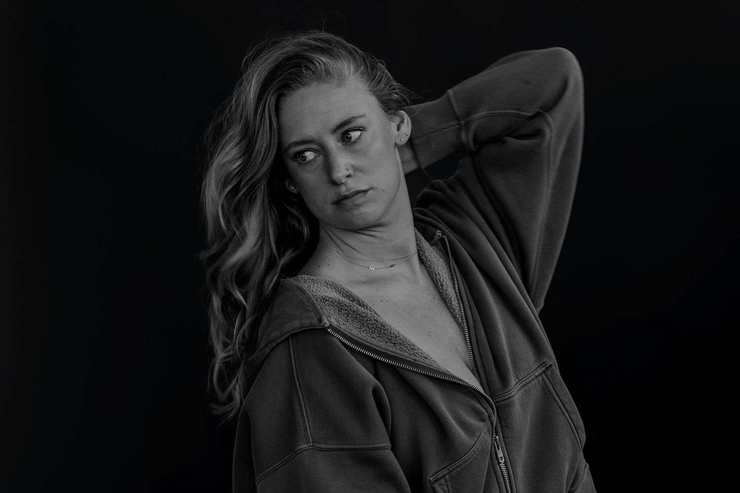 Artistic black and white portrait series showing emotional range.