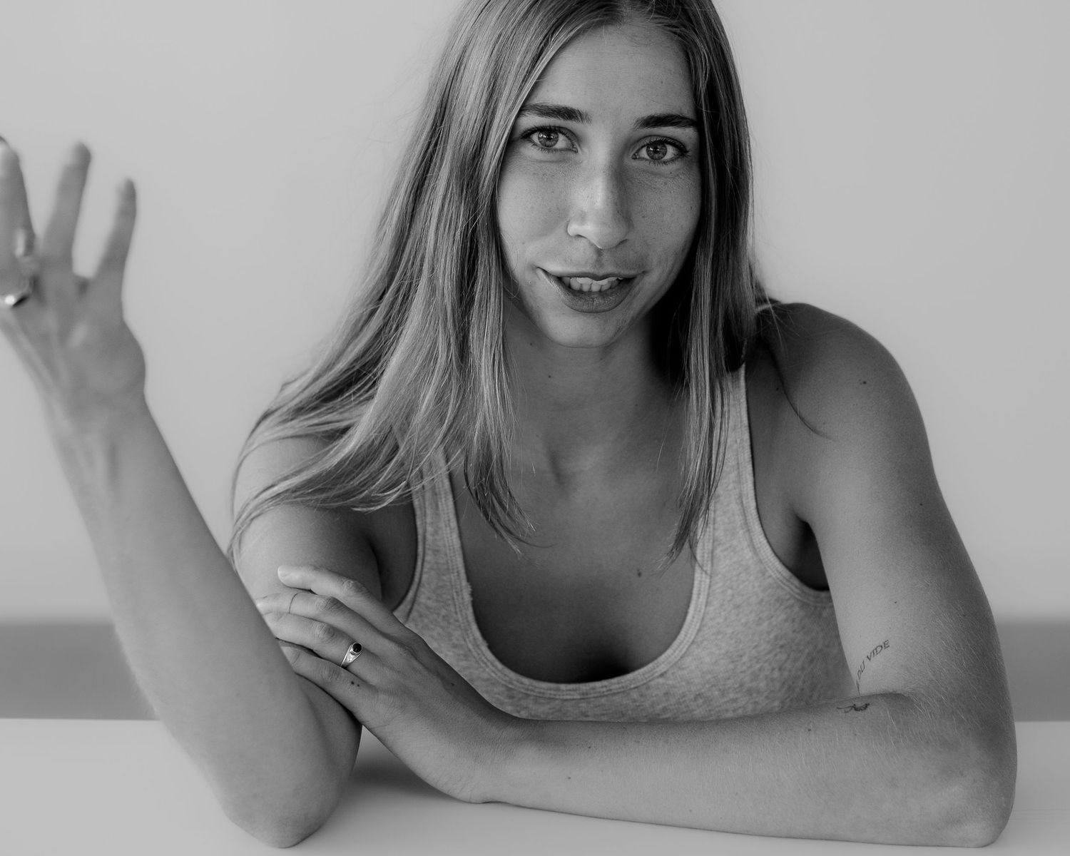 Black and white portrait series showing peaceful poses and hand gestures.