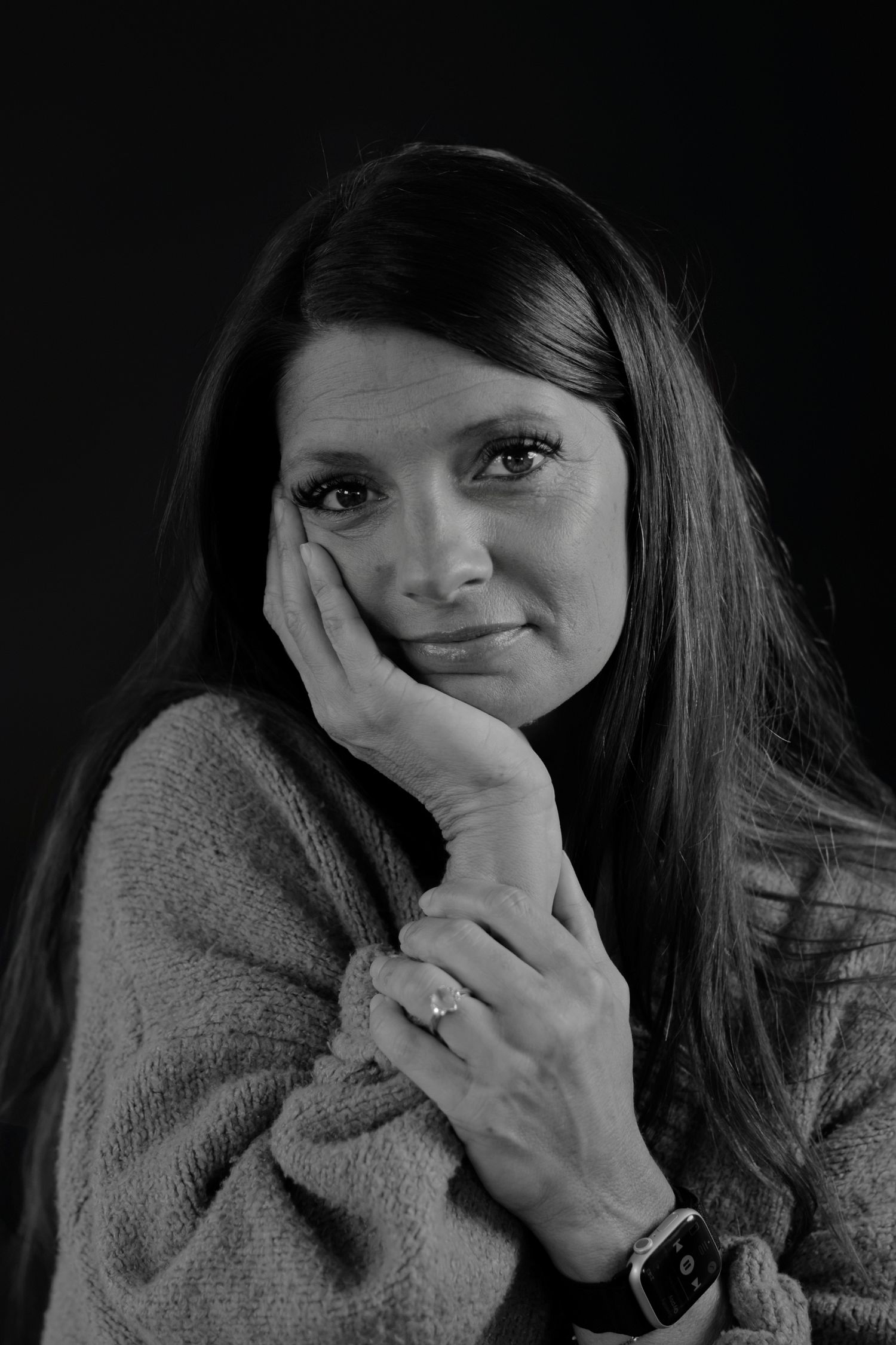 Intimate black and white portraits showing playful expressions and hand gestures.