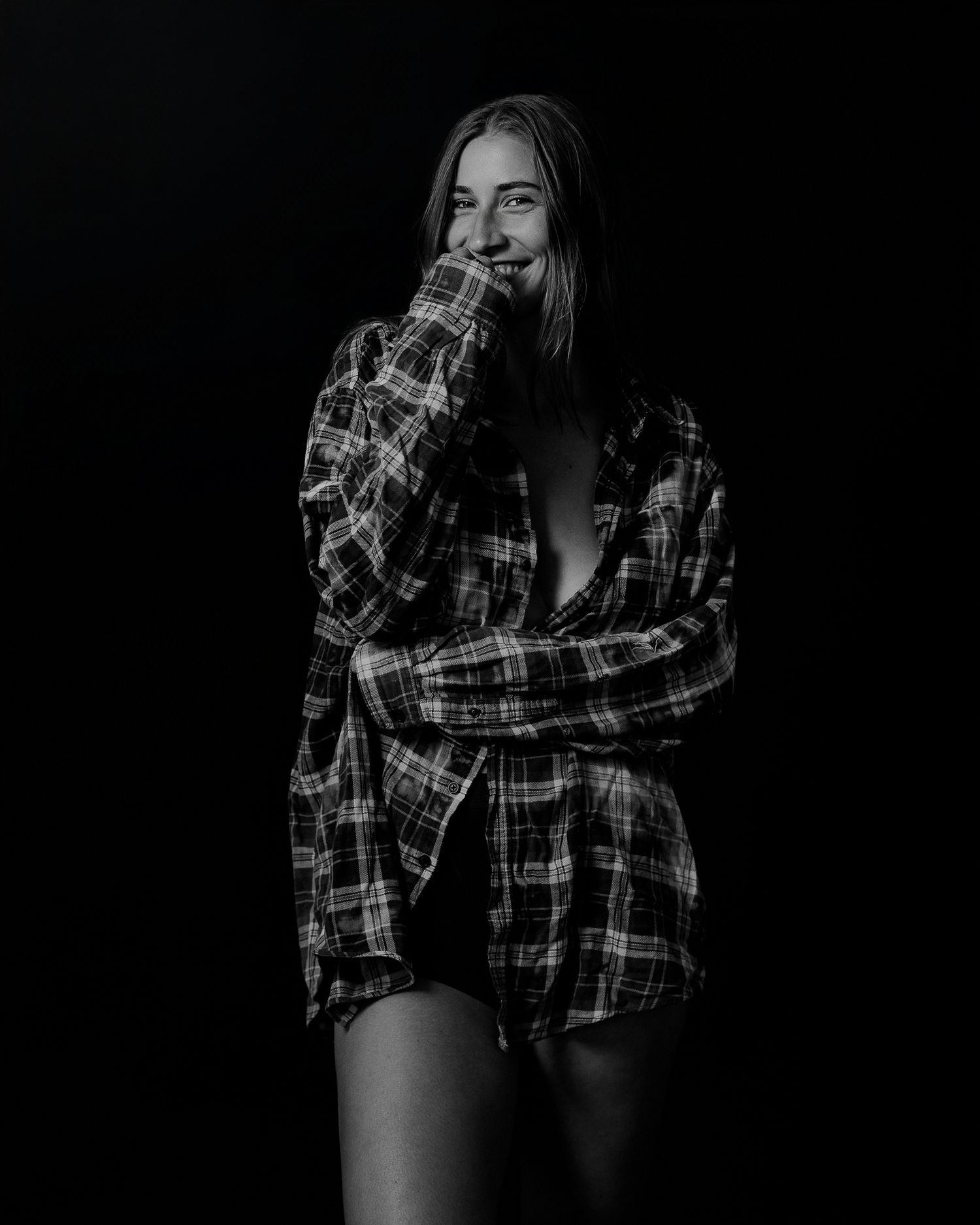 High contrast monochrome photos showing poses in casual plaid clothing.