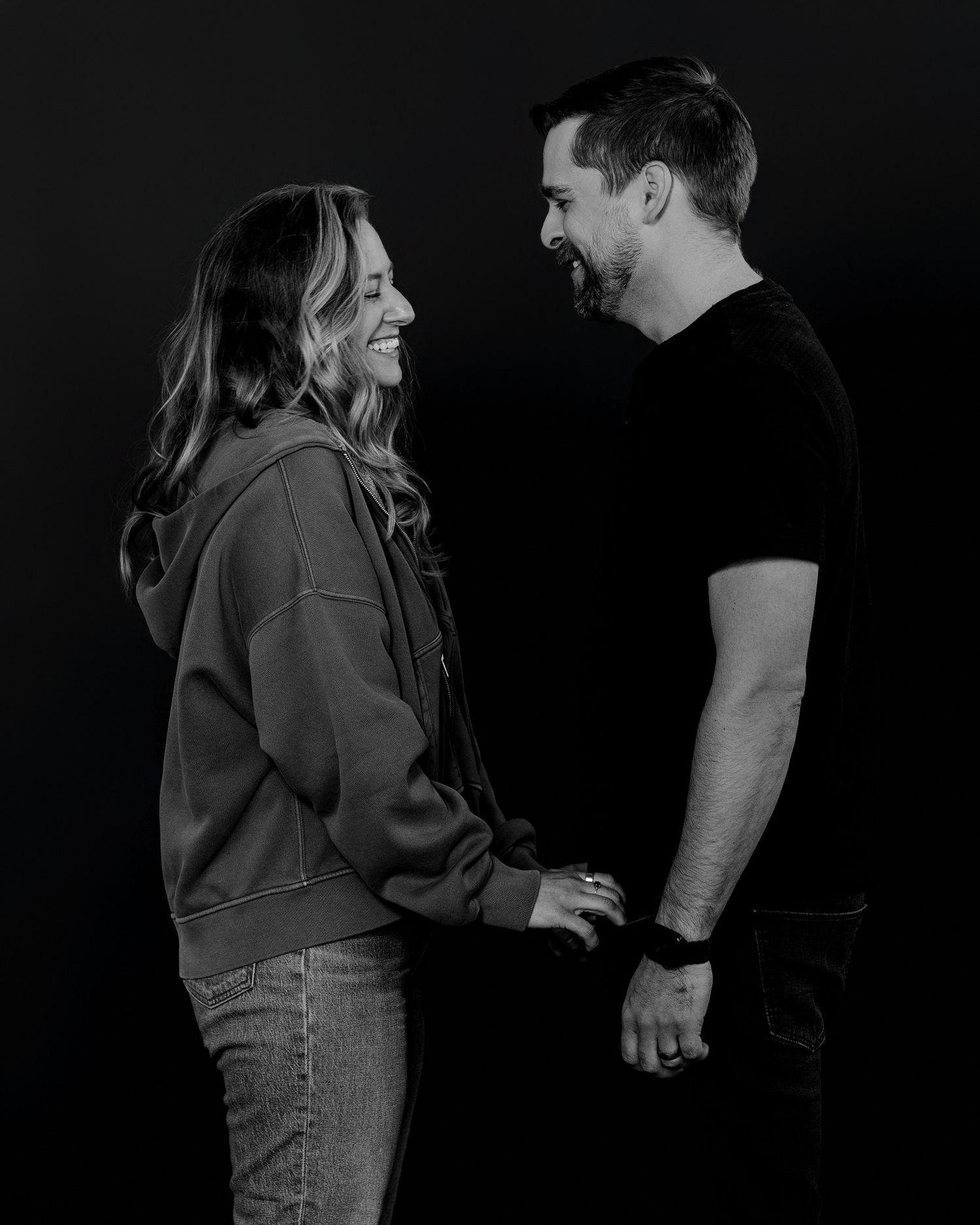 Candid black and white series showing couple's natural chemistry and connection.