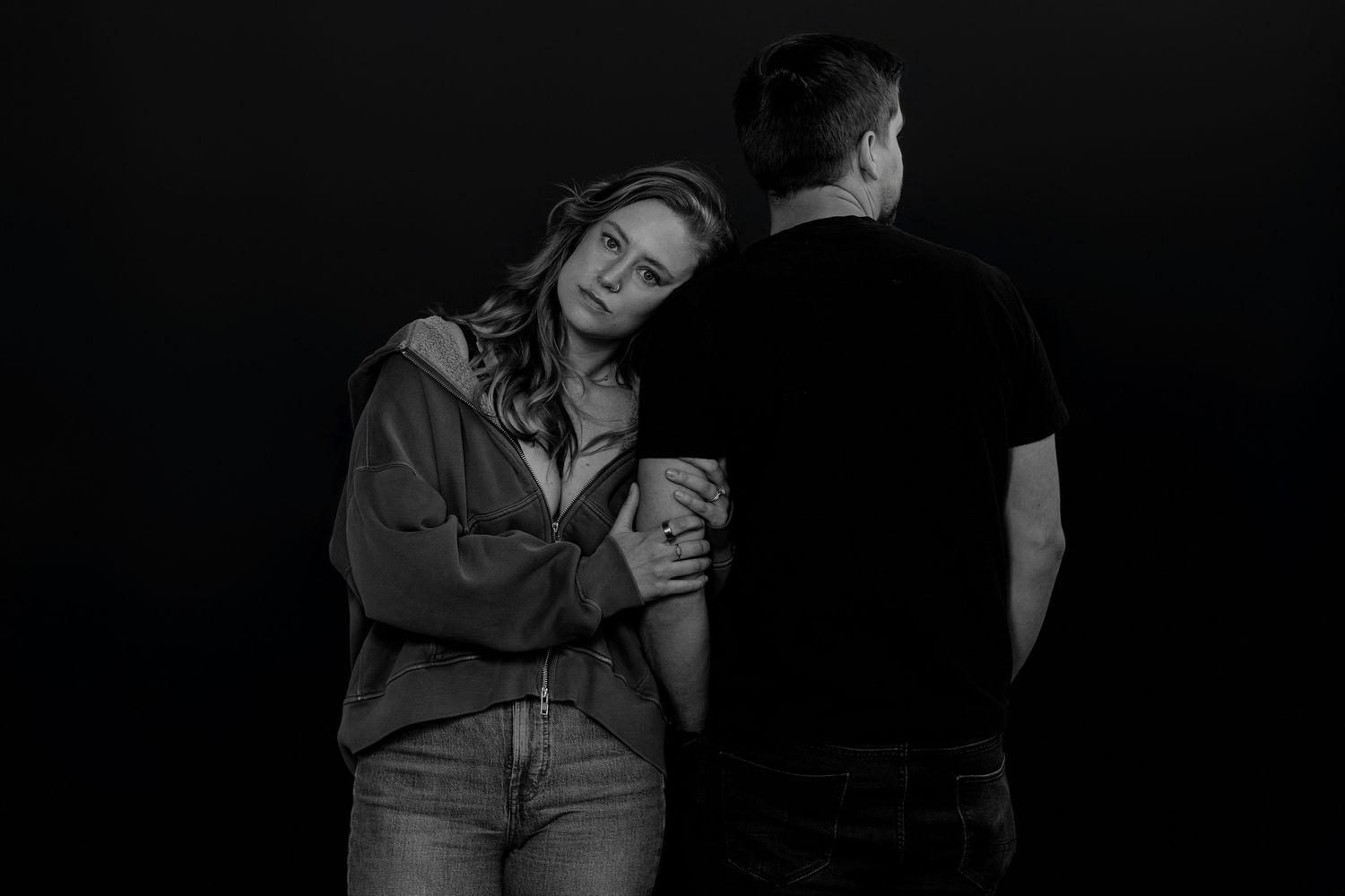 Dramatic black and white portraits capturing tender embraces and emotions.