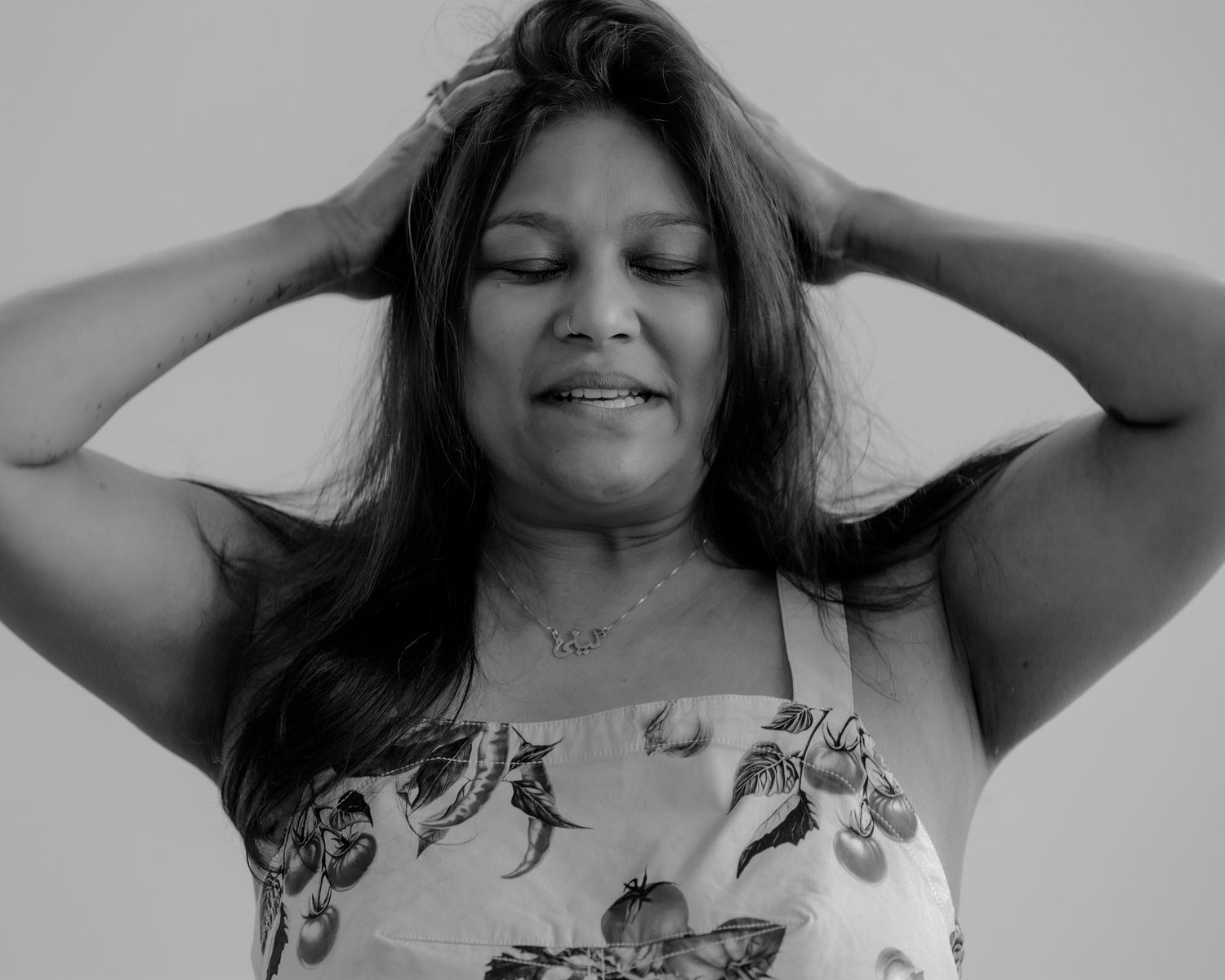 Black and white portraits showing relaxed poses and natural expressions.