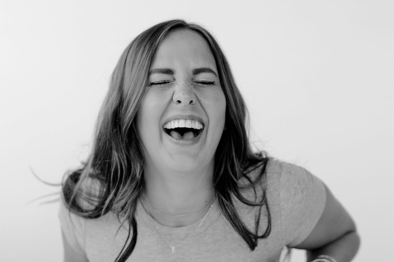 Dynamic black and white photographs capturing genuine moments of joy and laughter.