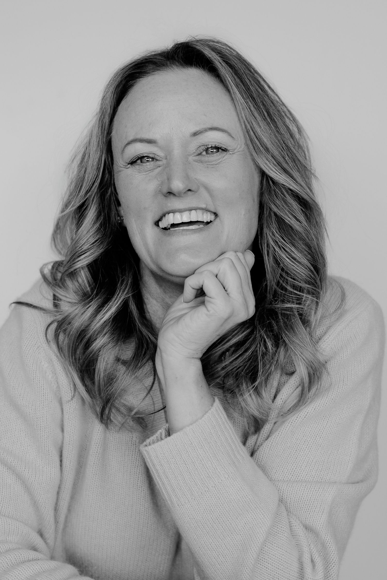 Series of candid expressions showing laughter and happiness in monochrome style.