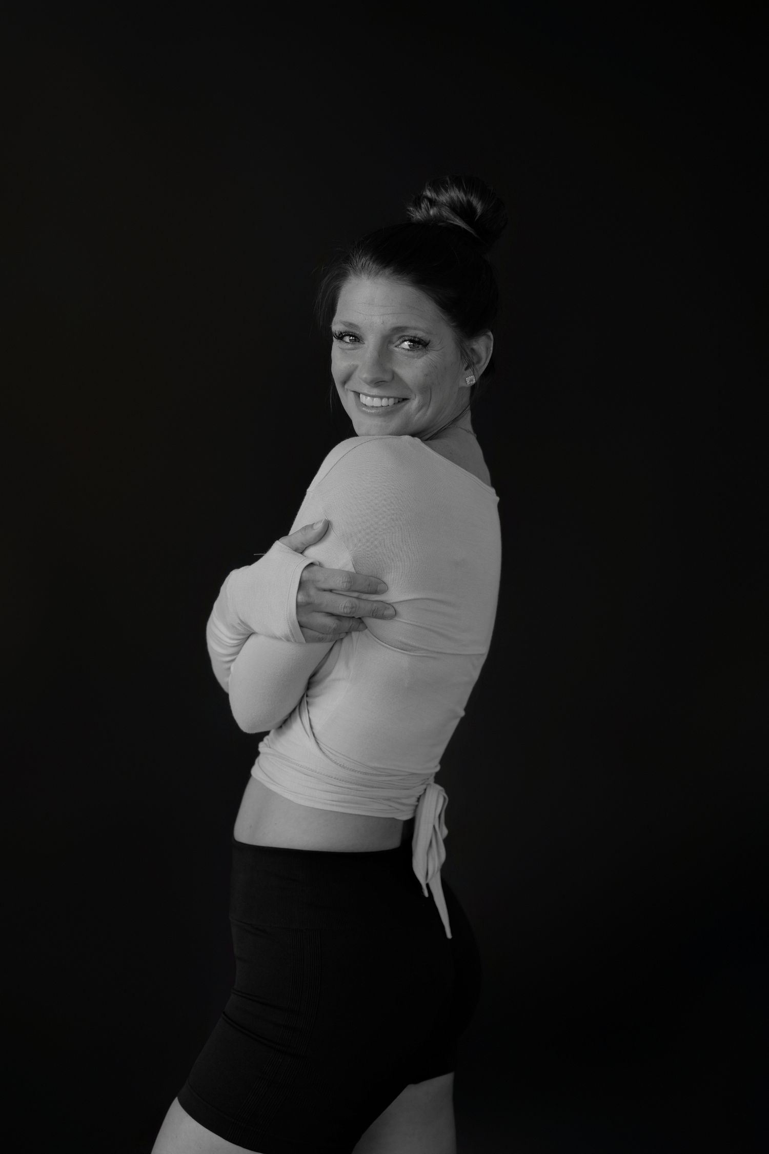 Expressive movement sequence showing joyful energy in black and white.