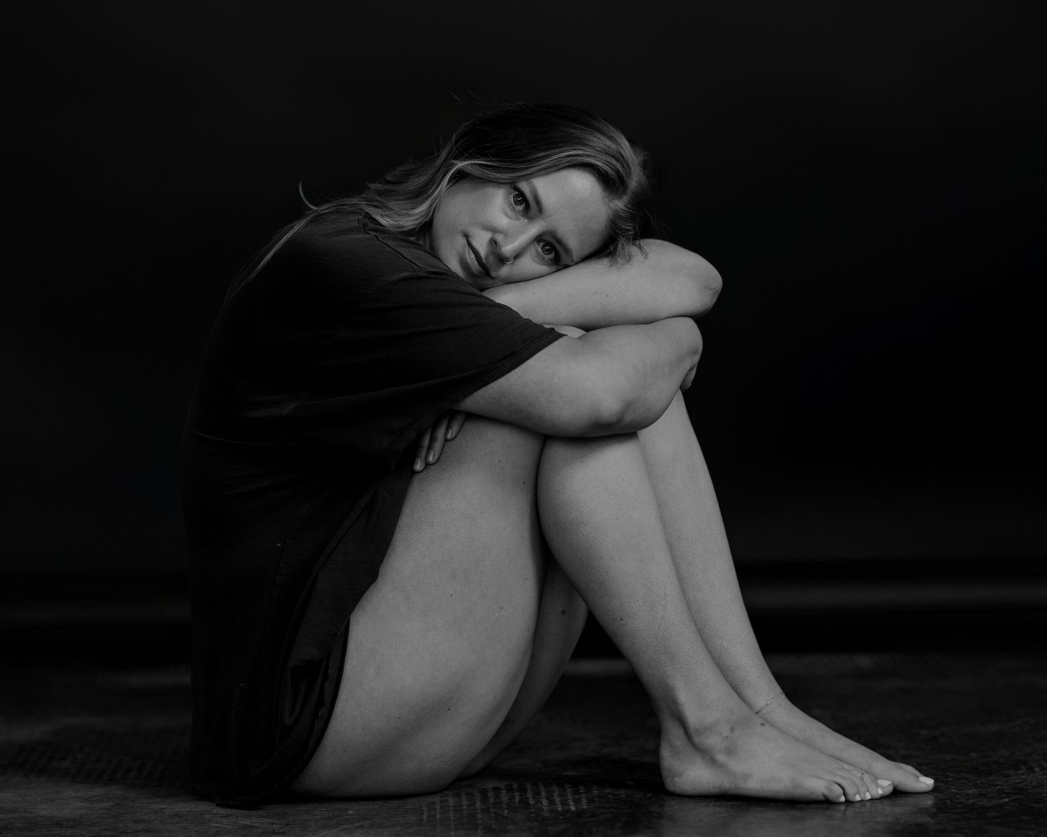 Intimate black and white portraits showing vulnerable emotional moments.