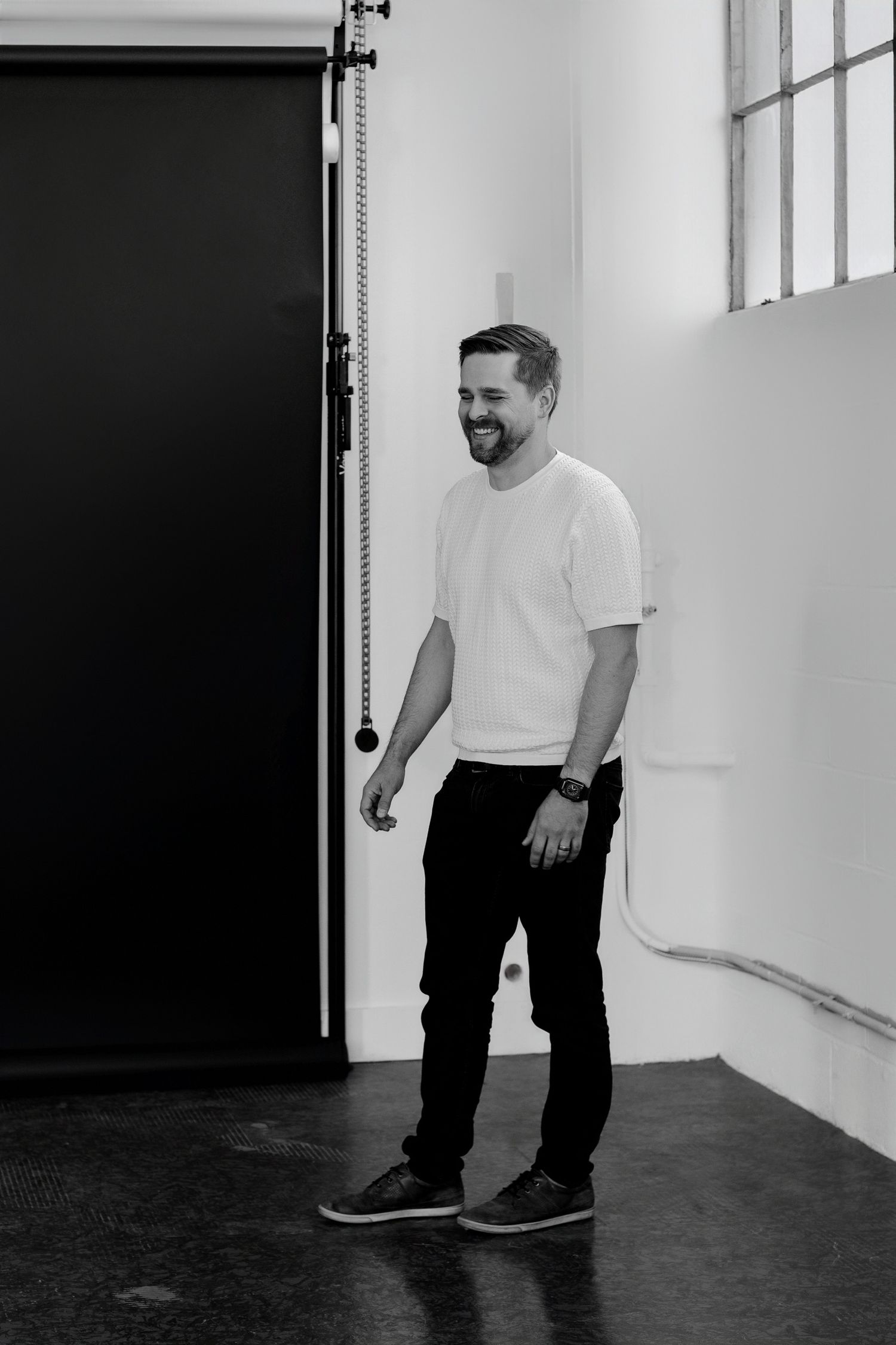 Minimalist portraits of person in white shirt against light background showing different poses.