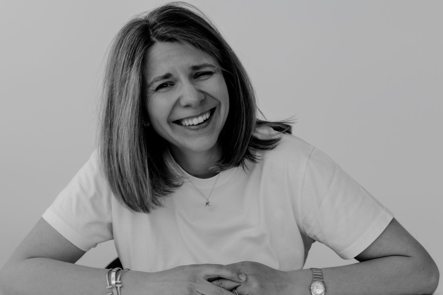 Series of candid black and white portraits showing natural joy and laughter.