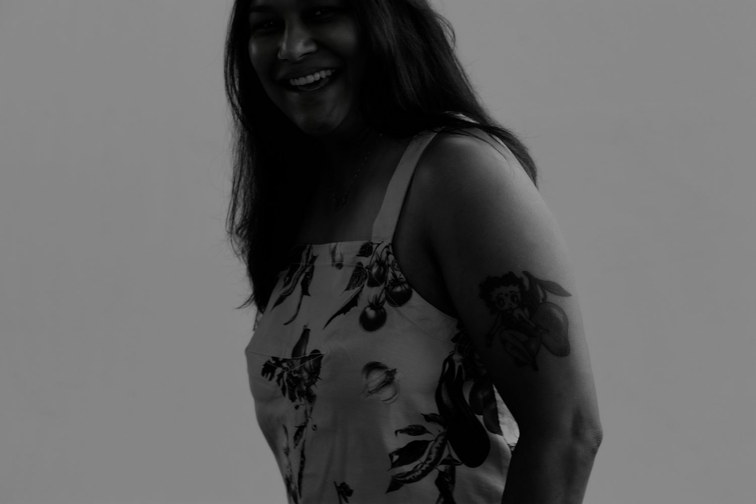 Series of candid expressions and poses in monochrome against plain background.
