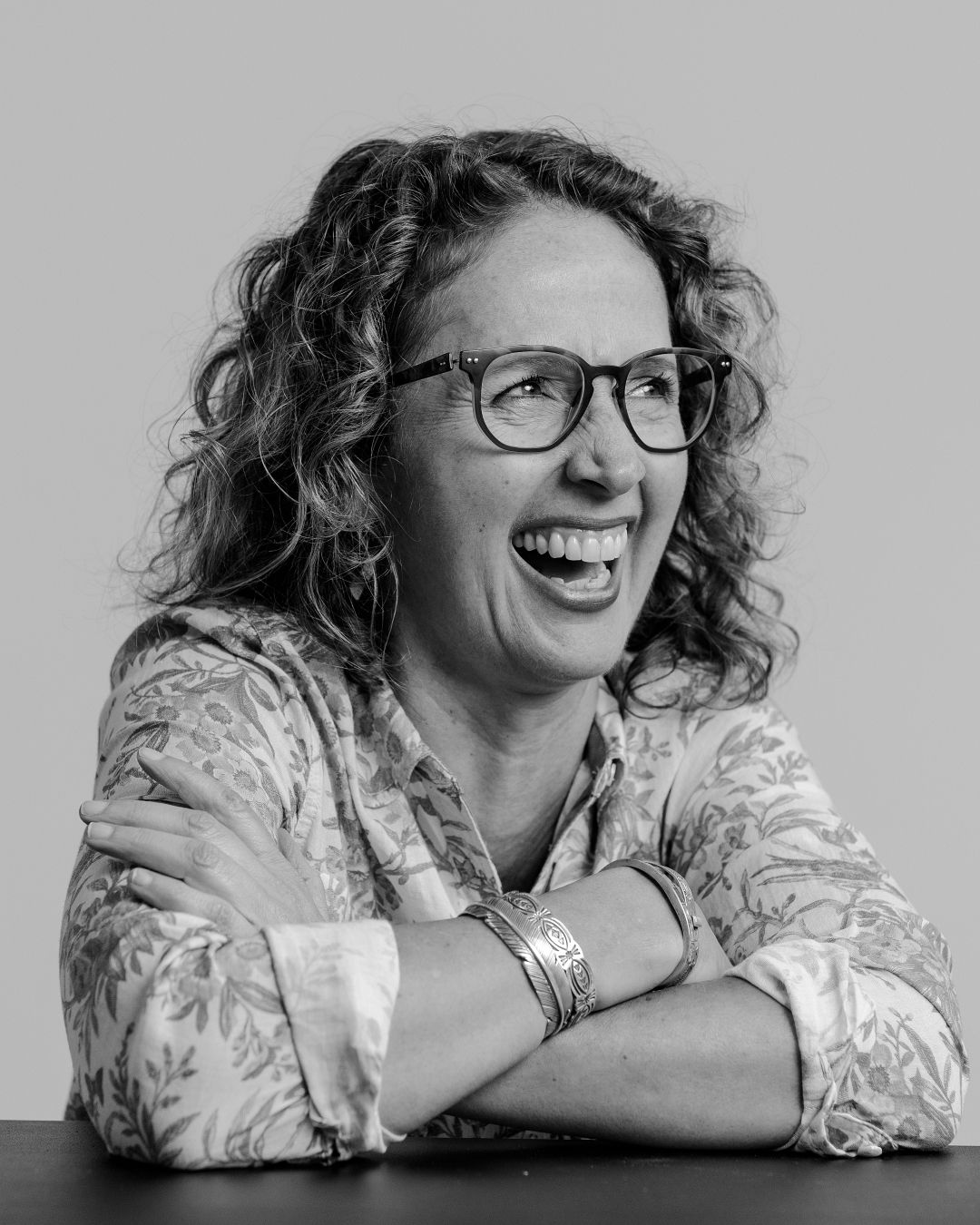 Collection of joyful and animated expressions in black and white photography.