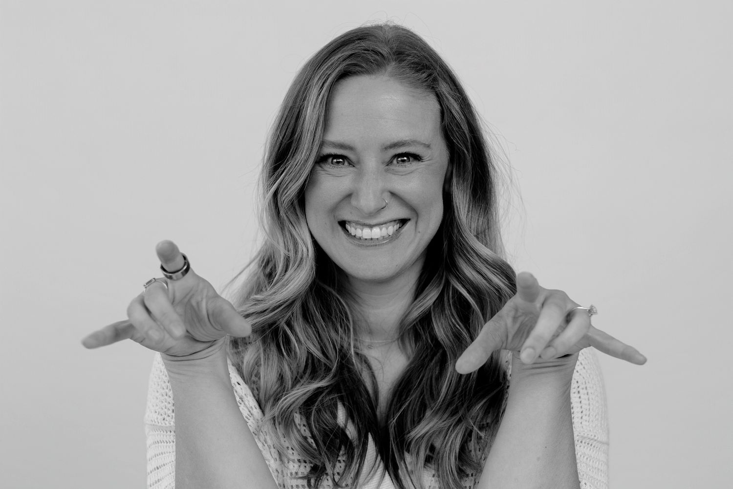 Person in white top displaying range of joyful and playful expressions.