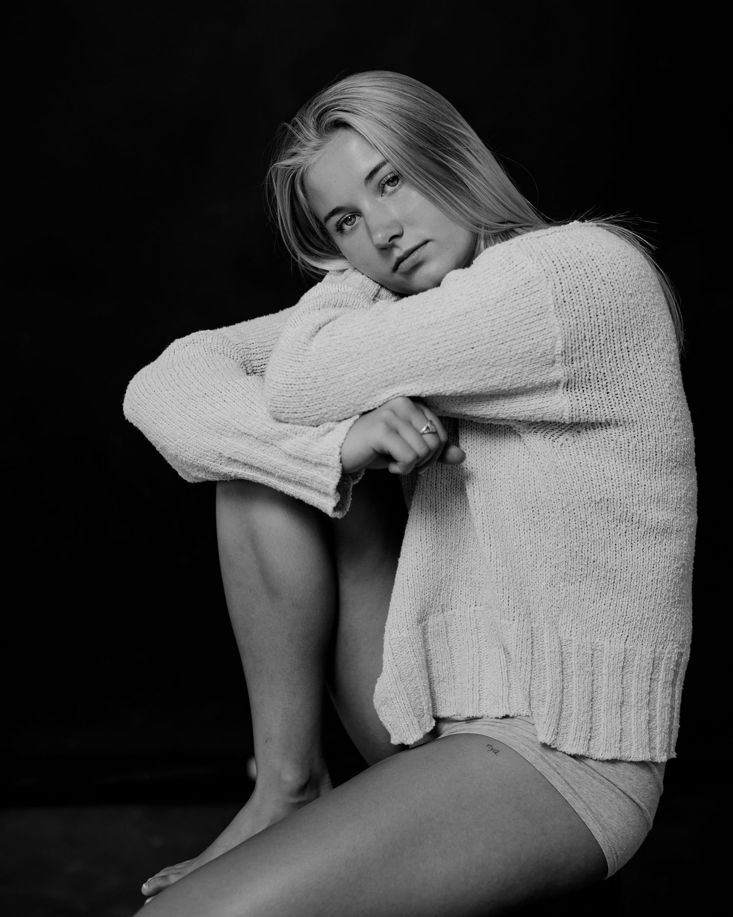 Artistic black and white series featuring intimate poses in monochromatic styling.